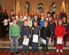 The Revd Sonia Gyles with teachers and and the school choir of Sandford Parish National School before the Annual School Carol Service.