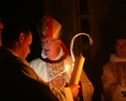 The Archbishop of Dublin, the Most Revd Dr John Neill lighting the Paschal Candle at the Easter Vigil in Christ Church Cathedral.