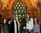 Howard the donkey is welcomed to Killiskey Parish Church by associate vicar, the Revd Ken Rue and parishioners. 