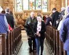 Sarah Flynn escorts Howard the donkey out of Nun’s Cross Church when he had completed his Palm Sunday duties in Wicklow and Killiskey. 