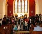 A section of families present in a group photograph at the Discovery Diocesan Thanksgiving Service with Archbishop Jackson and his wife.