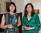 Photographer Mella Travers and painter Maeve McCarthy at the opening of their exhibition, ‘Reflections’ – the first to be held in the new community art gallery in St Michan’s Church. Their work can be seen behind them. 