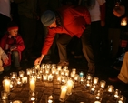 Placing a candle at a vigil organised by Christian Aid, Amnesty International and Trócaire calling for a ceasefire in Gaza.