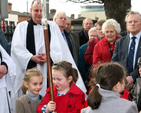 This little girl was given the responsibility of minding the Archbishop’s crosier while he dedicated the new noticeboard for North Strand Church and St Columba’s School which was erected in memory Cecil Cooper.