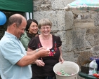 The Revd Canon George Butler, Rector of Castlemacadam, Ballinatone and Aughrim draws the first raffle winner at the Ballinatone Parish Fete in Co Wicklow.