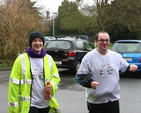 Jacob Caldwell and Naomi Quinn, both ordinands at the Church of Ireland Theological Institute finish their run and cycle for charity at the institute.