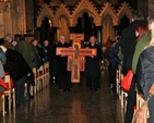 Archbishop Michael Jackson and Archbishop Diarmuid Martin carry the Taizé cross down the aisle of Christ Church Cathedral as they embark on the Ecumenical Procession of the Cross through the streets of Dublin to the Pro–Cathedral on Good Friday.