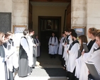 Pictured is the Revd Darren McCallig dismissing the Choir following Choral Eucharist in the college chapel. Also pictured (back left) is the Revd Clare Herbert of Inclusive Church who preached in the Chapel.