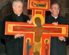 Archbishop Michael Jackson and Archbishop Diarmuid Martin outside Christ Church Cathedral as they prepare to carry the Taizé Cross for the Ecumenical Procession of the Cross through the streets of Dublin to the Pro–Cathedral on Good Friday.