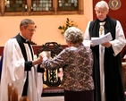 Members of the parish of St Catherine and St James with St Audoen present Canon Mark Gardner with symbols of the teaching, pastoral and sacramental ministry of an incumbent at his institution as rector of the new union of parishes. 