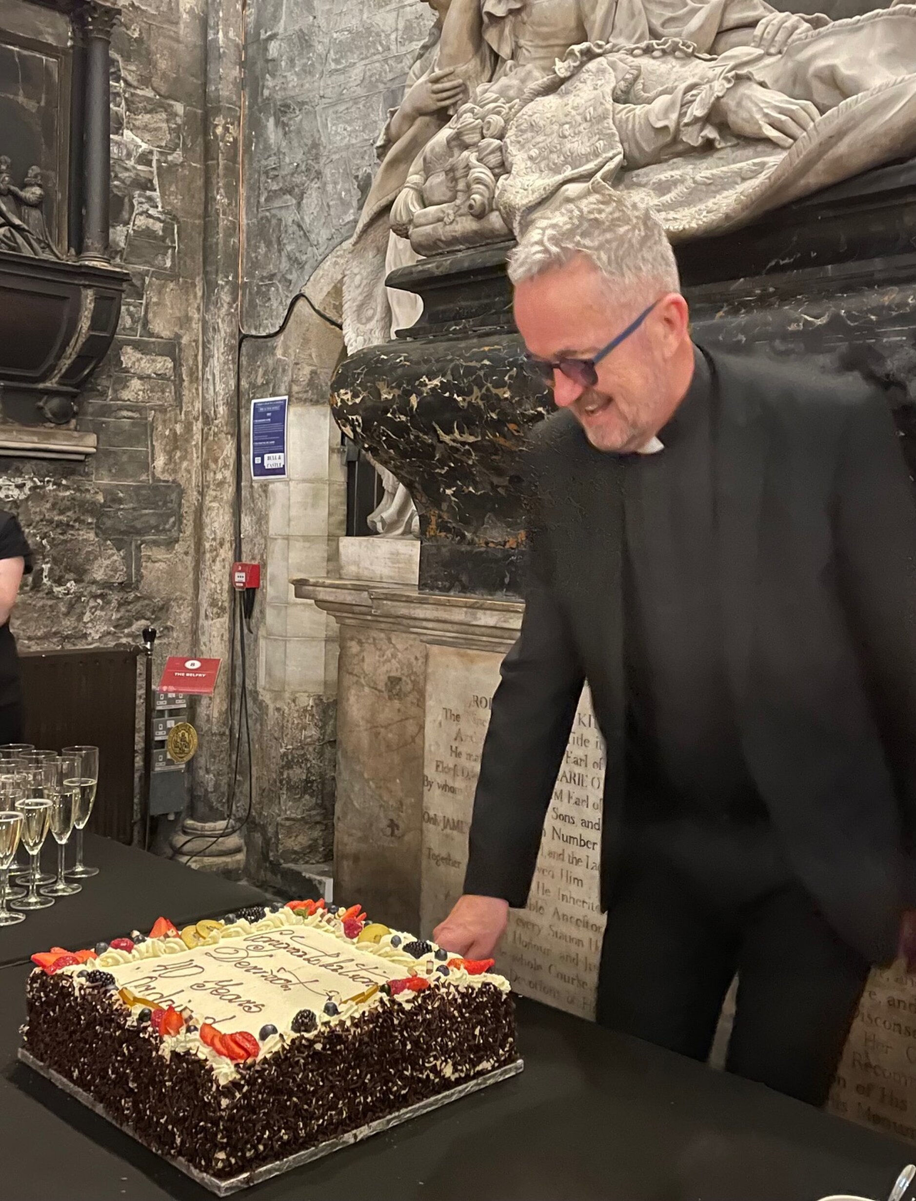 Dean Celebrates Milestone Anniversary - Dean Dermot Dunne celebrated the 40th anniversary of his ordination on Sunday morning last (June 9). He marked the occasion with his wife Celia and members of the cathedral community and visitors after the 11am Eucharist. He is pictured cutting the cake specially baked for the day. 
