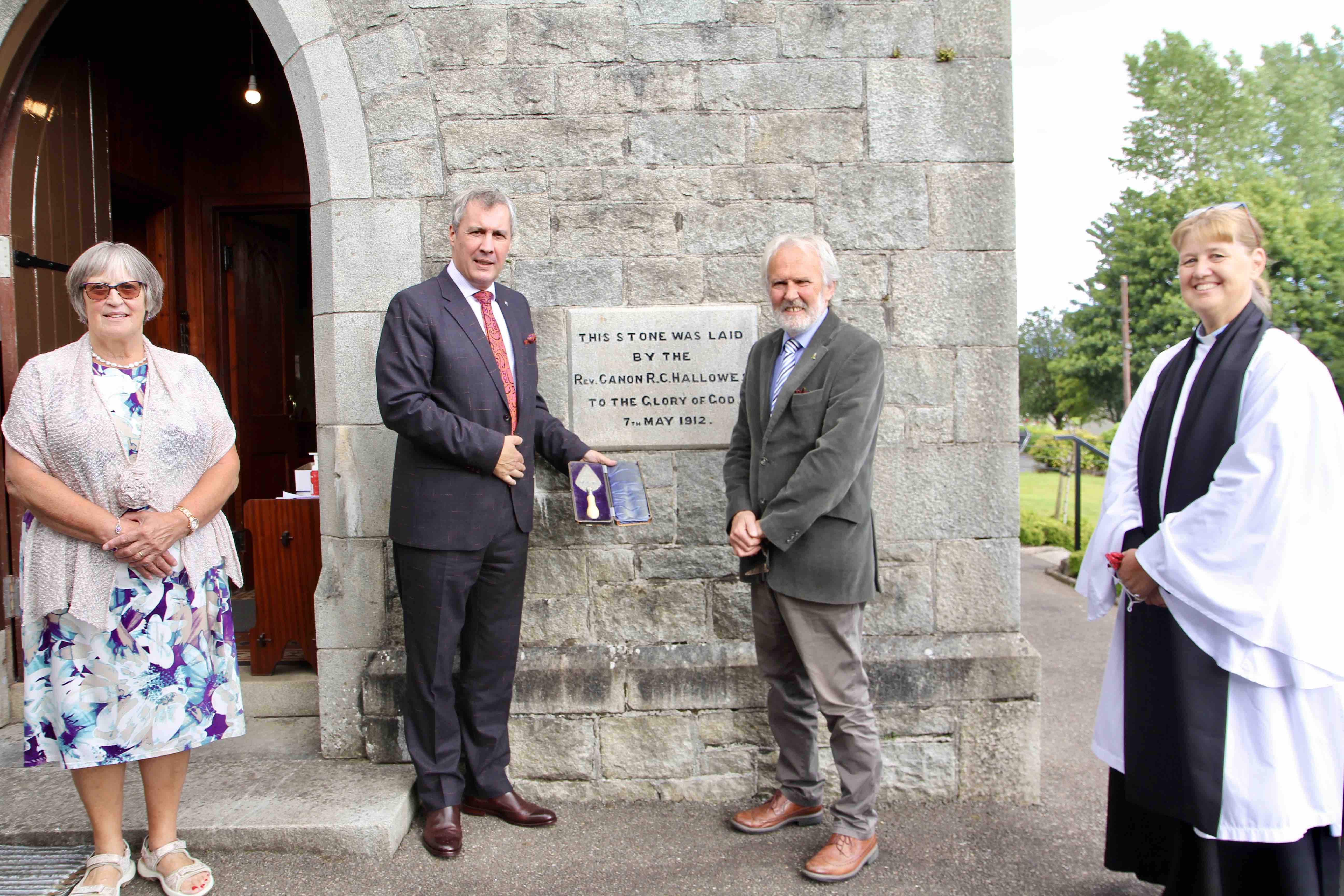 Michael Hallowes with the trowel used by his great grandfather Canon Richard Hallowes and church wardens Sadie Agar and Alan Pierce with the Rector the Revd Suzanne Harris.