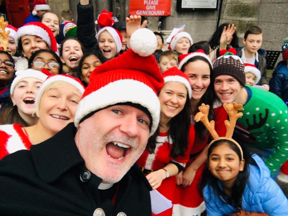 Canon David Gillespie with his helpers from St Andrew's NS in Lucan.