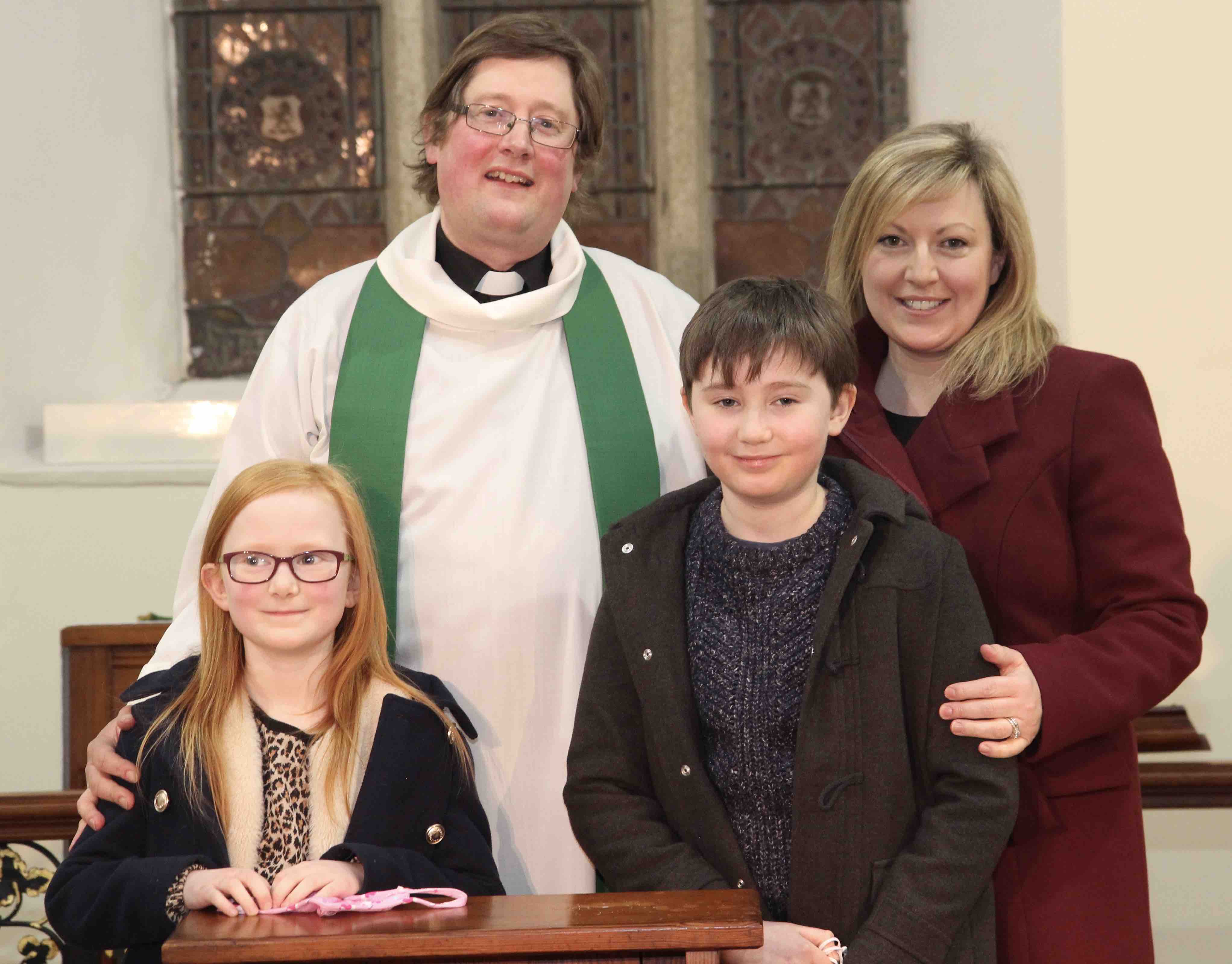 The Revd Ross Styles and his wife Fiona and their children in Newcastle Parish Church.