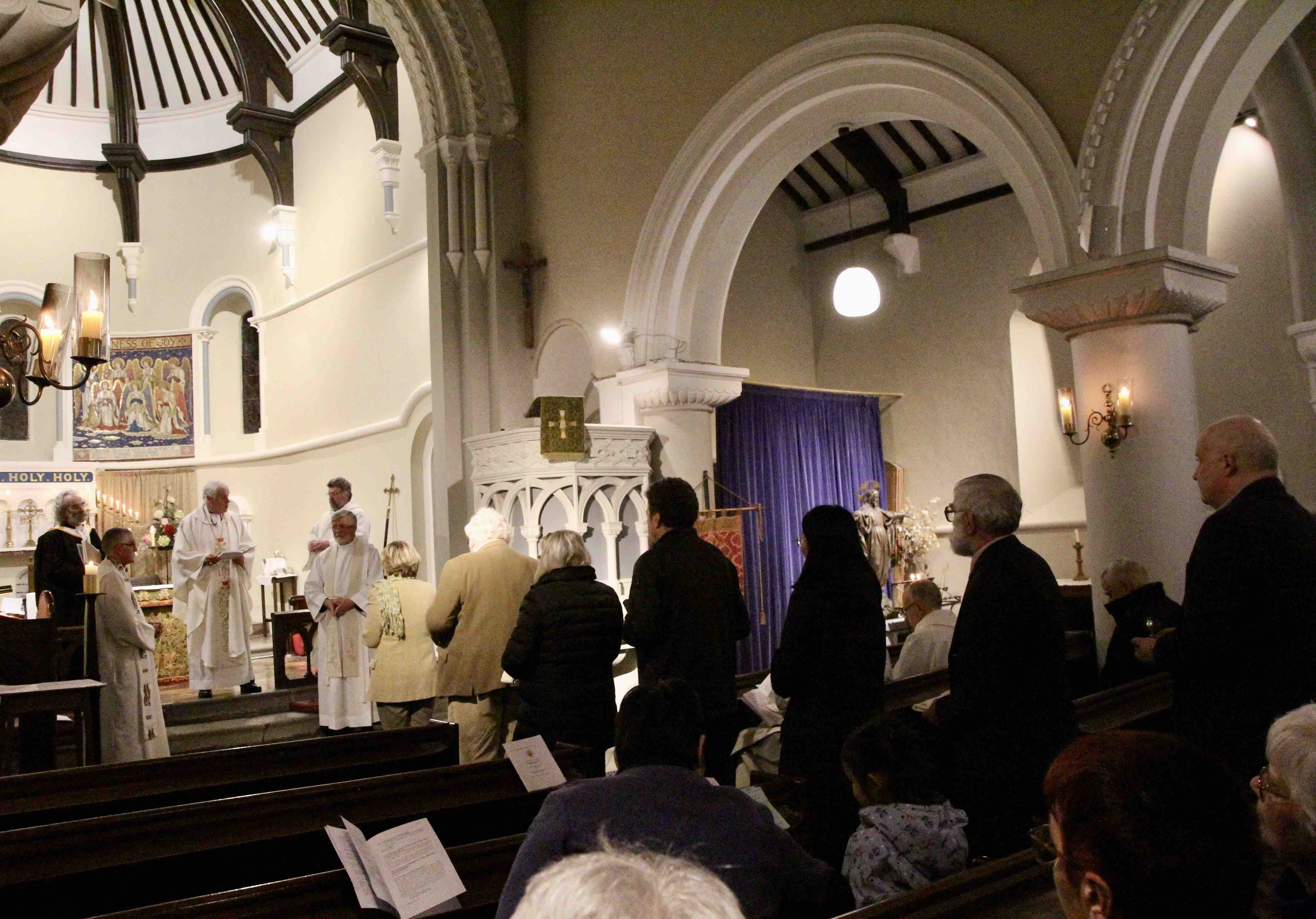 The symbols of ministry are presented to Canon Jones.