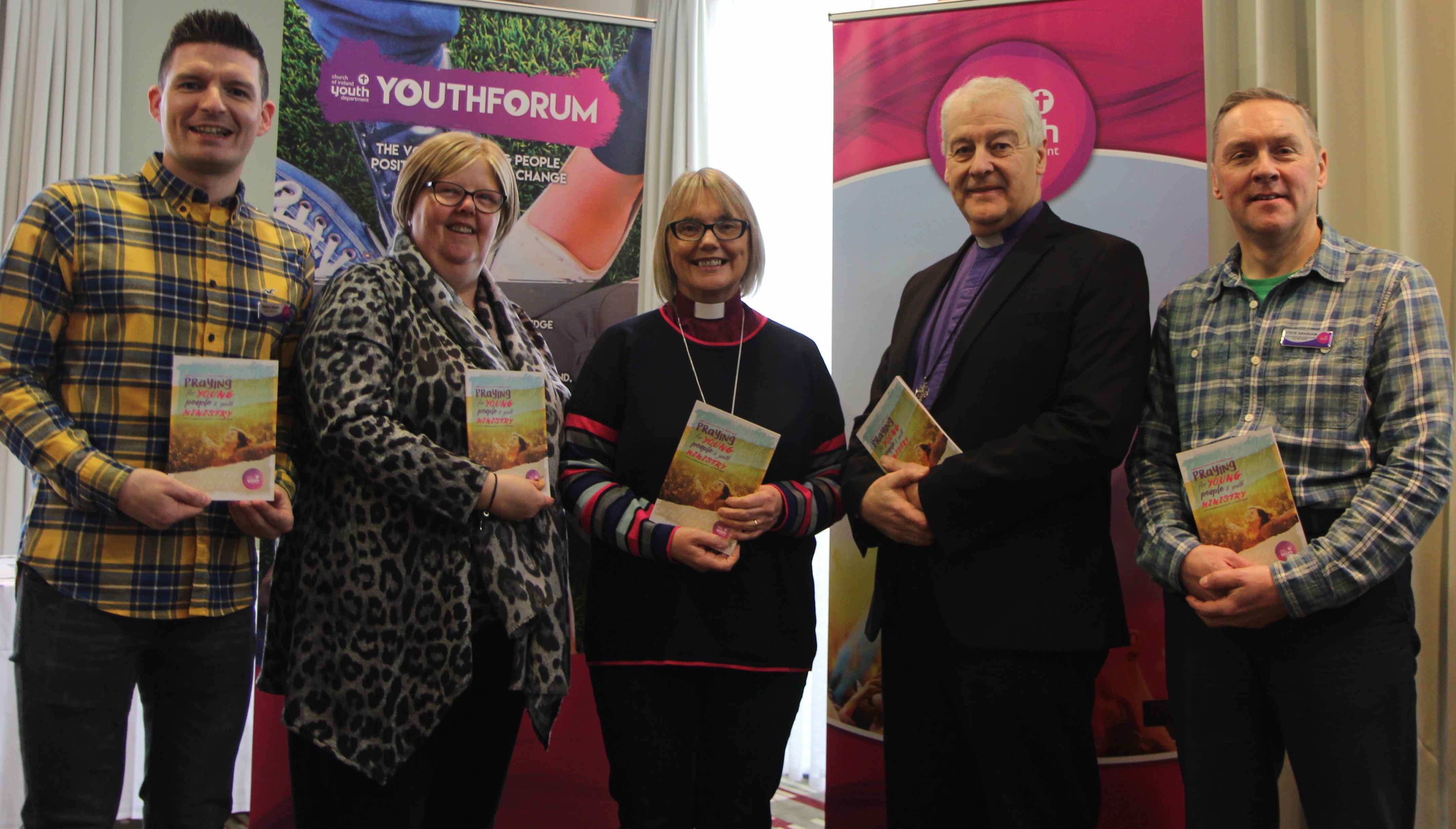 Simon Henry (CIYD), Barbara Swann (CIYD), Bishop Pat Storey (Chairperson of CIYD), Archbishop Michael Jackson and Steve Grasham (CIYD) at the Church of Ireland Youth Forum with the new Prayer Resource for the CIYD Day of Prayer.