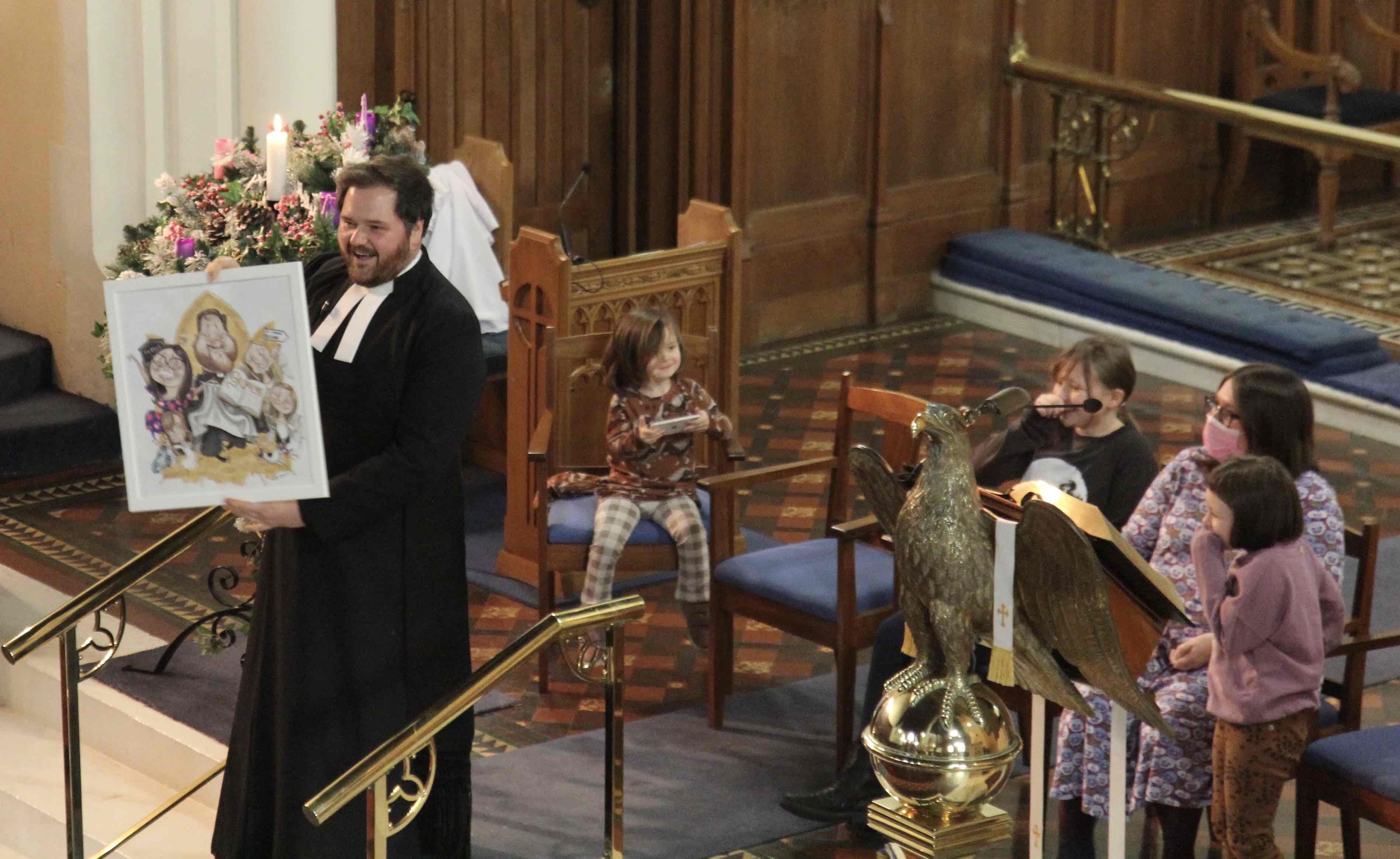 The Revd Stephen Farrell admires one of the gifts given by parishioners to mark his departure.