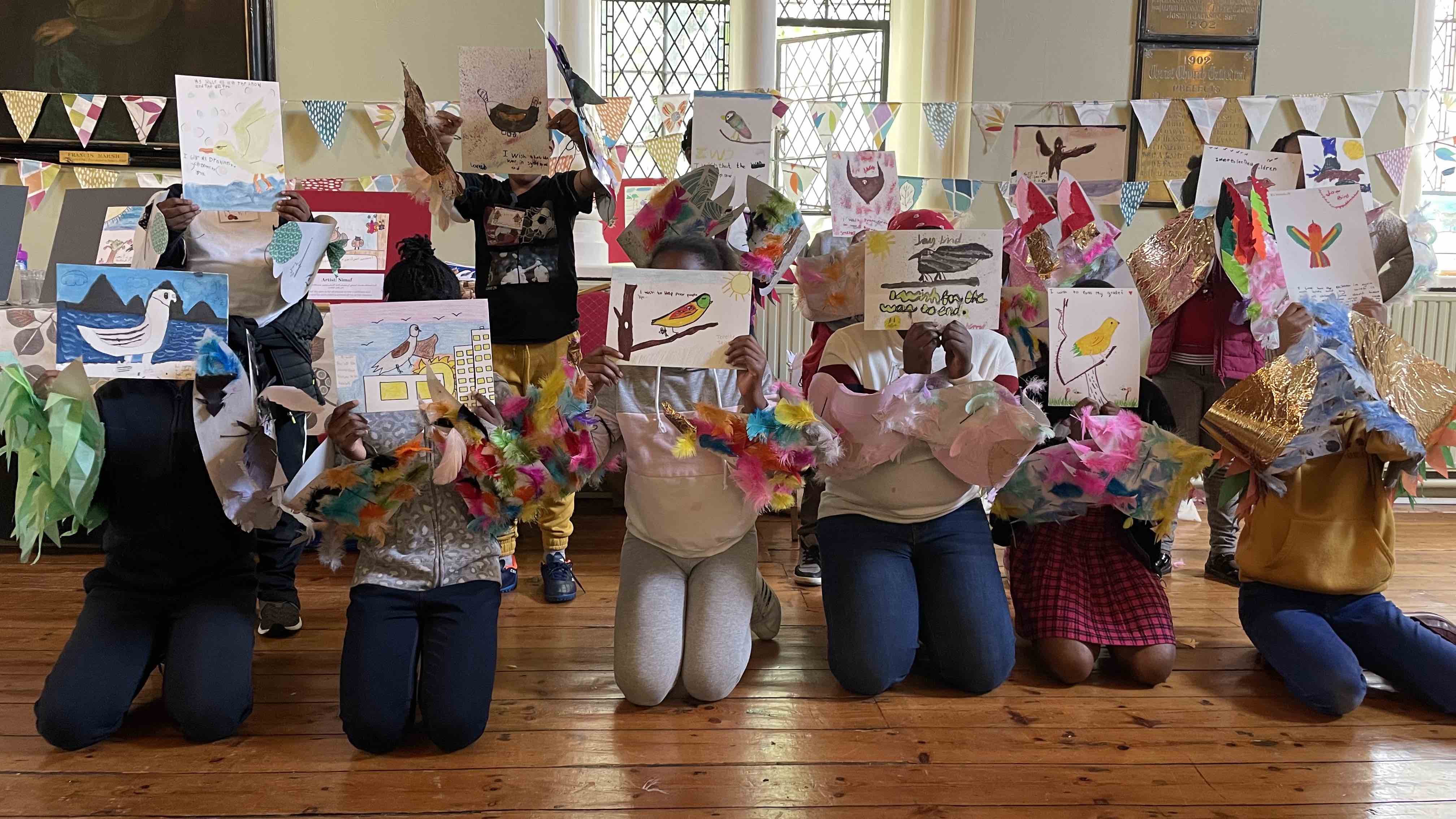 Some of the children who took part in the camp show their work.