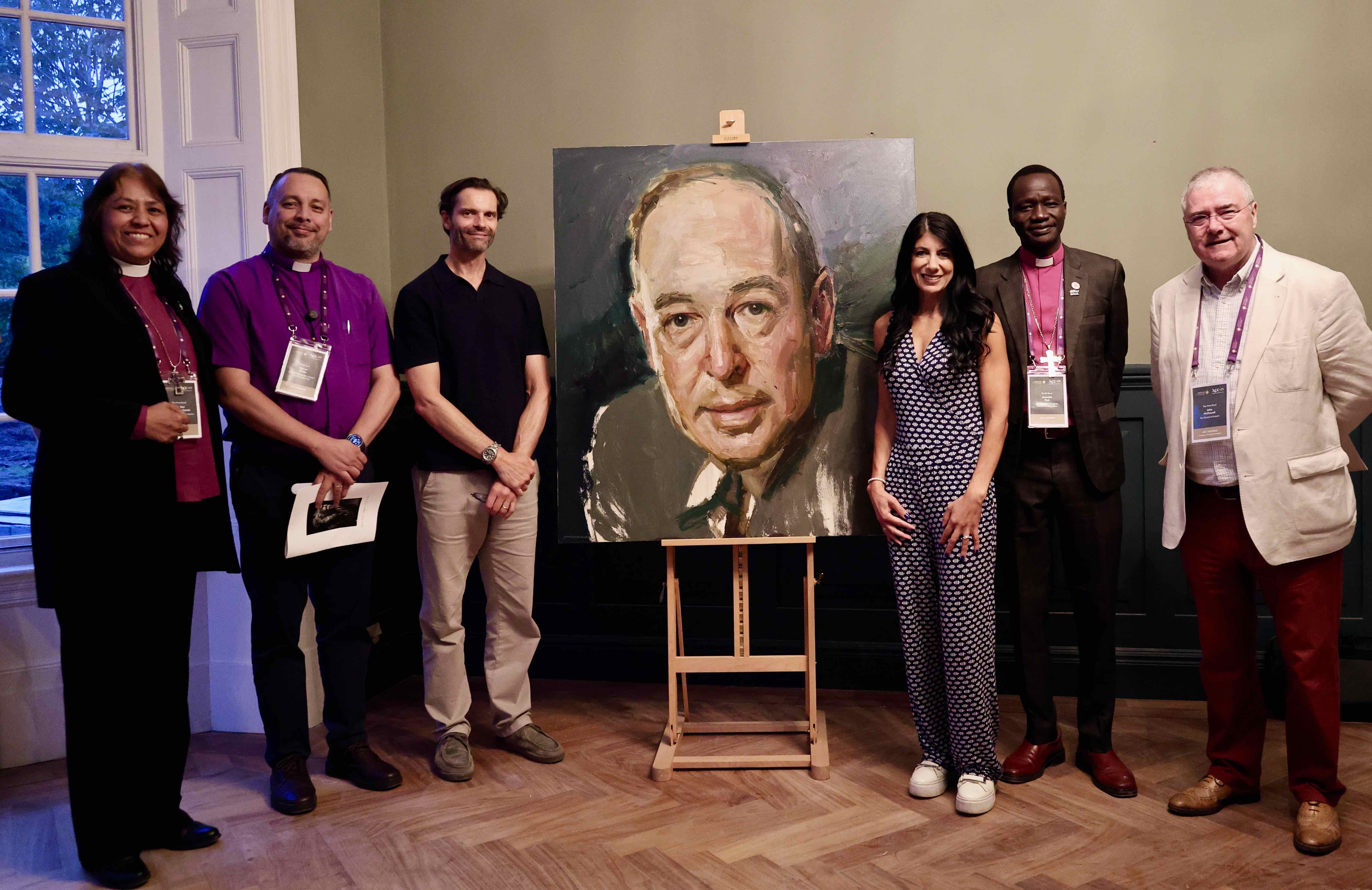 Archbishop Alba Sally Sue Hernandezm (Mexico), Bishop Ramon Ovalle Leiva (Guatemala), Chris McDowell, Gina Copty, Bishop Jeremiah Paul (Ethiopia) and Archbishop John McDowell with the newly unveiled painting of CS Lewis in his former home in Belfast.