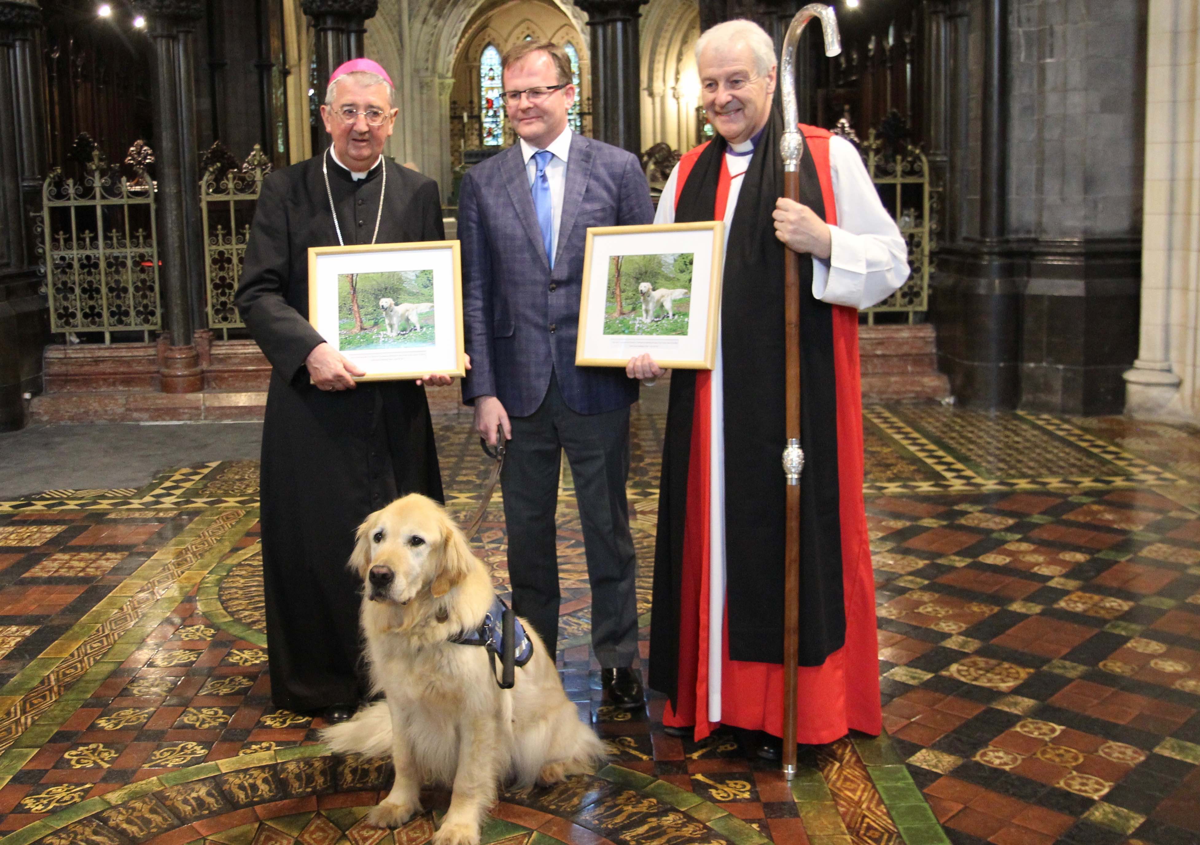 Archbishop Diarmuid Martin, Pat Burke of the Irish Guide Dogs for the Blind and Archbishop Michael Jackson with one of the ambassador dogs.