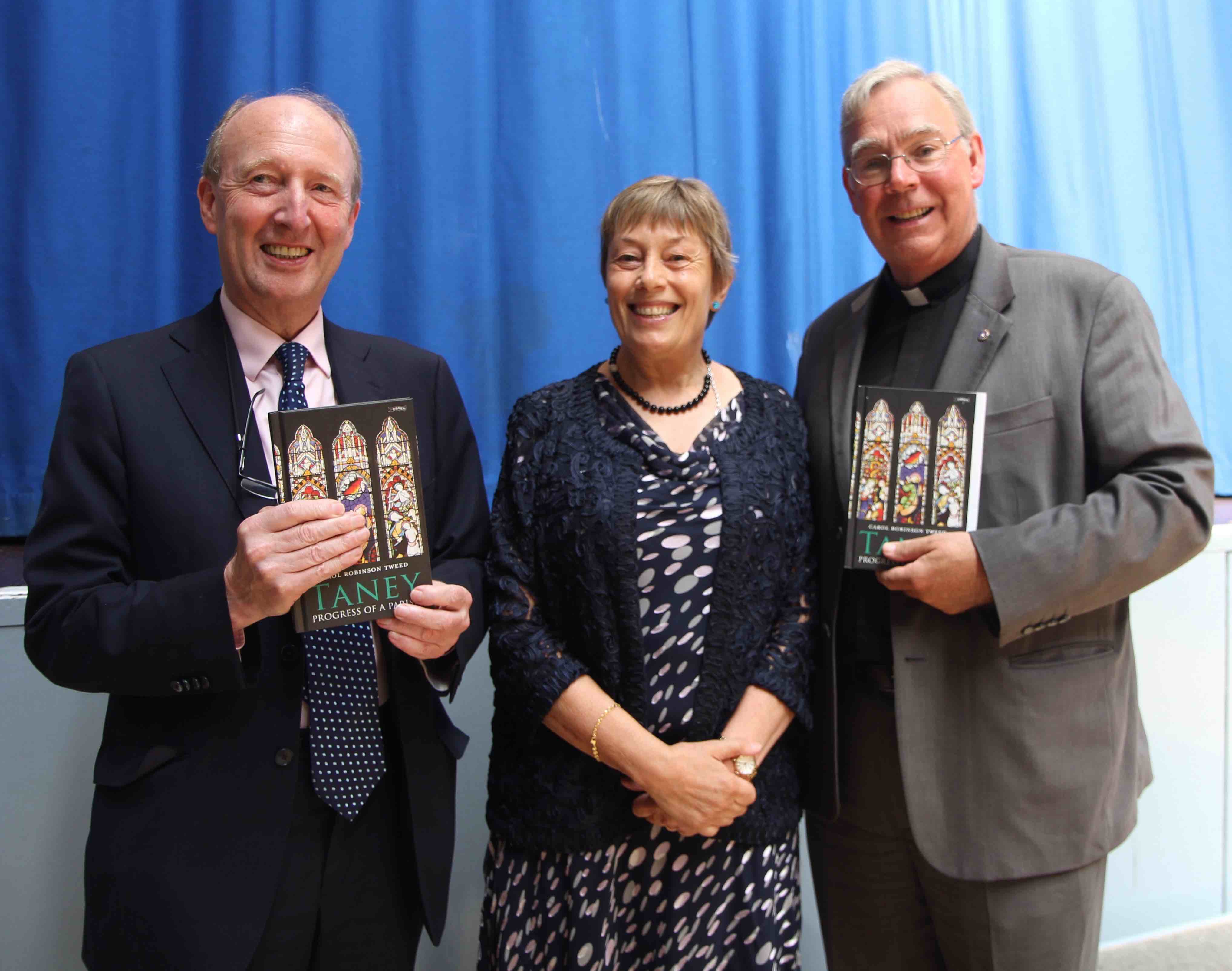 Minister Shane Ross (left) officially launched the updated parish history of Taney by Carol Robinson Tweed. They are pictured with the Rector Canon Robert Warren.