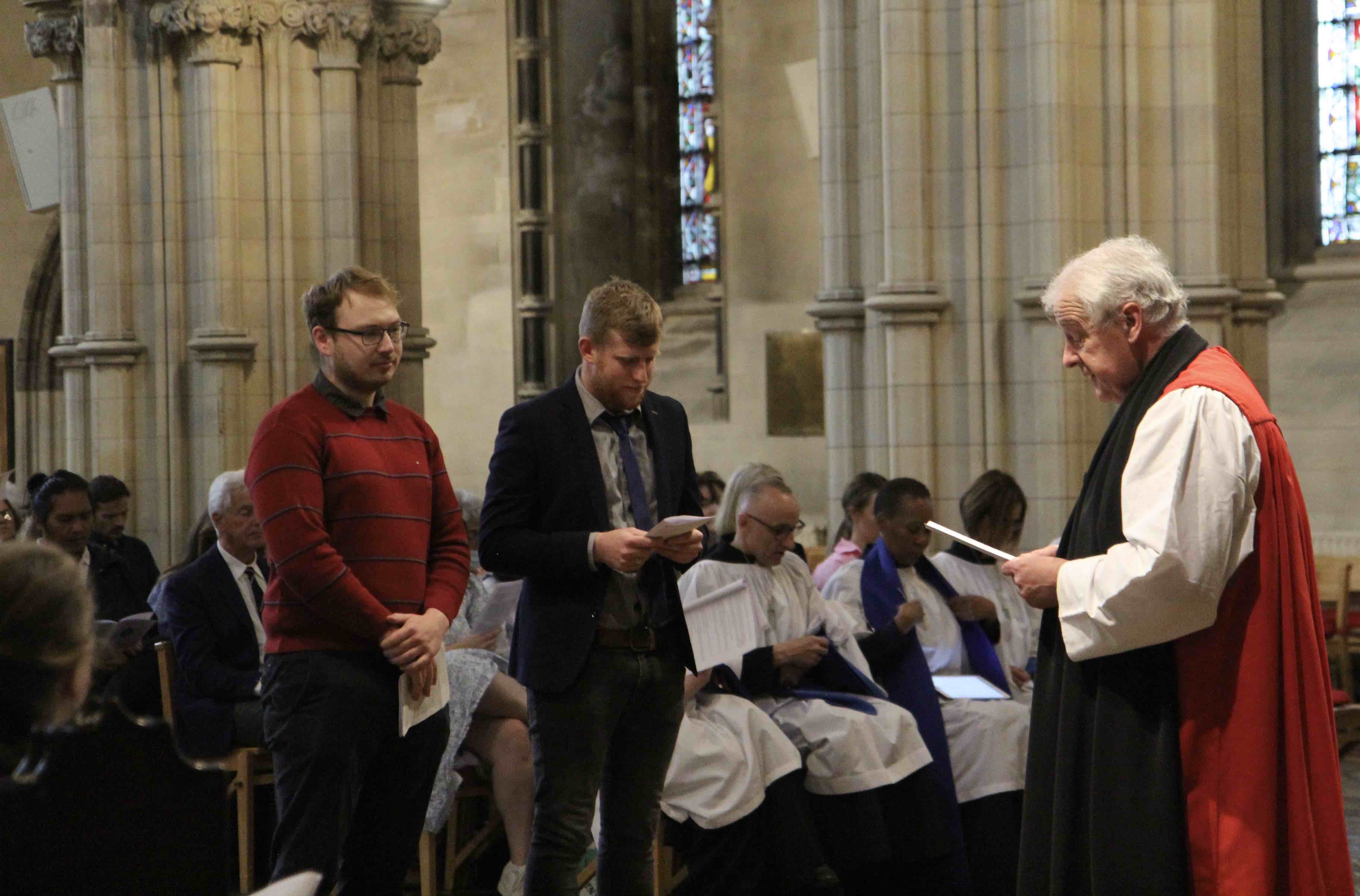 Parish Readers Seb Dungan and Brian Hickey are commissioned by Archbishop Michael Jackson.