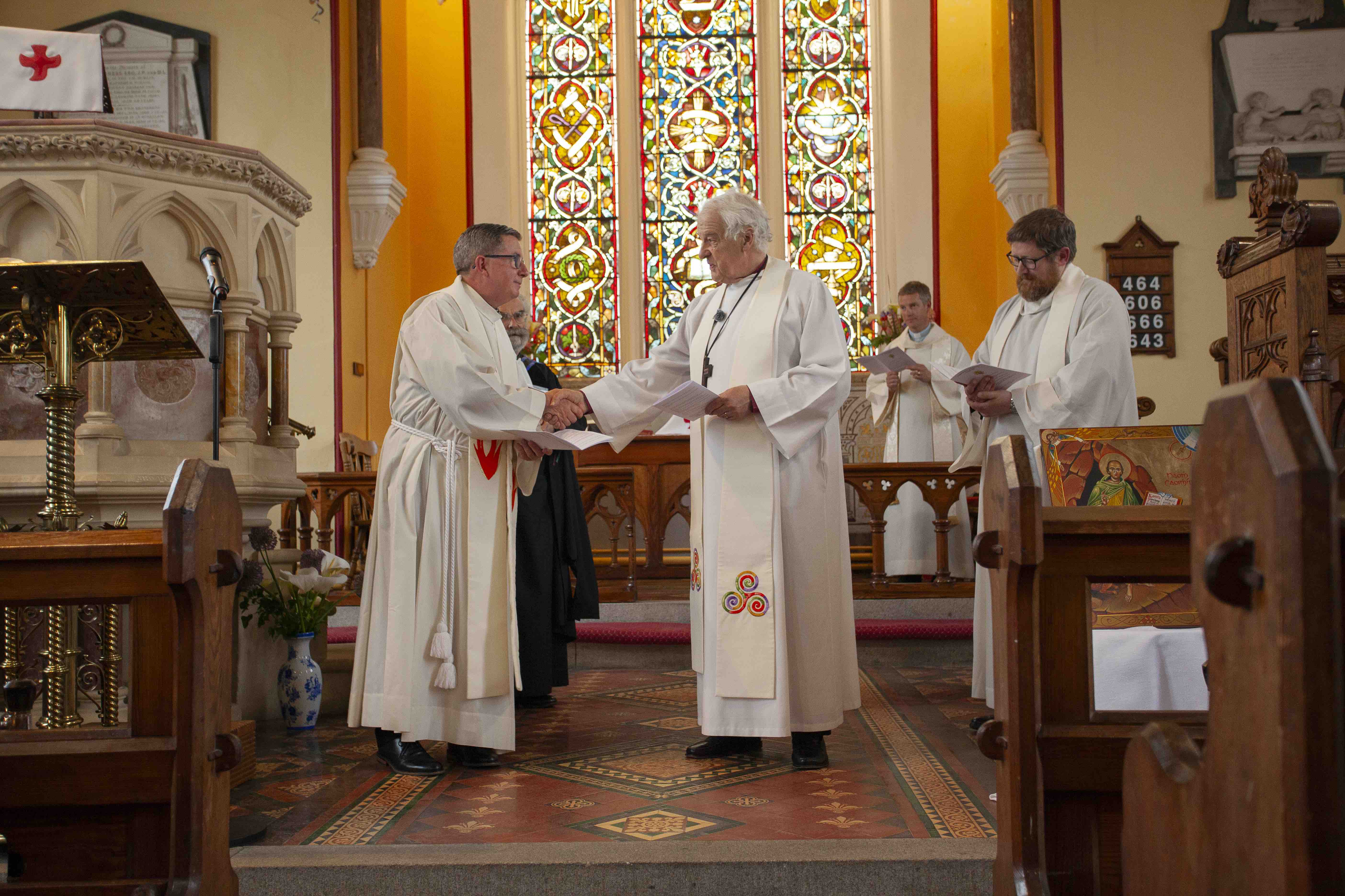 Archbishop Michael Jackson congratulates the Revd Billy Burke.