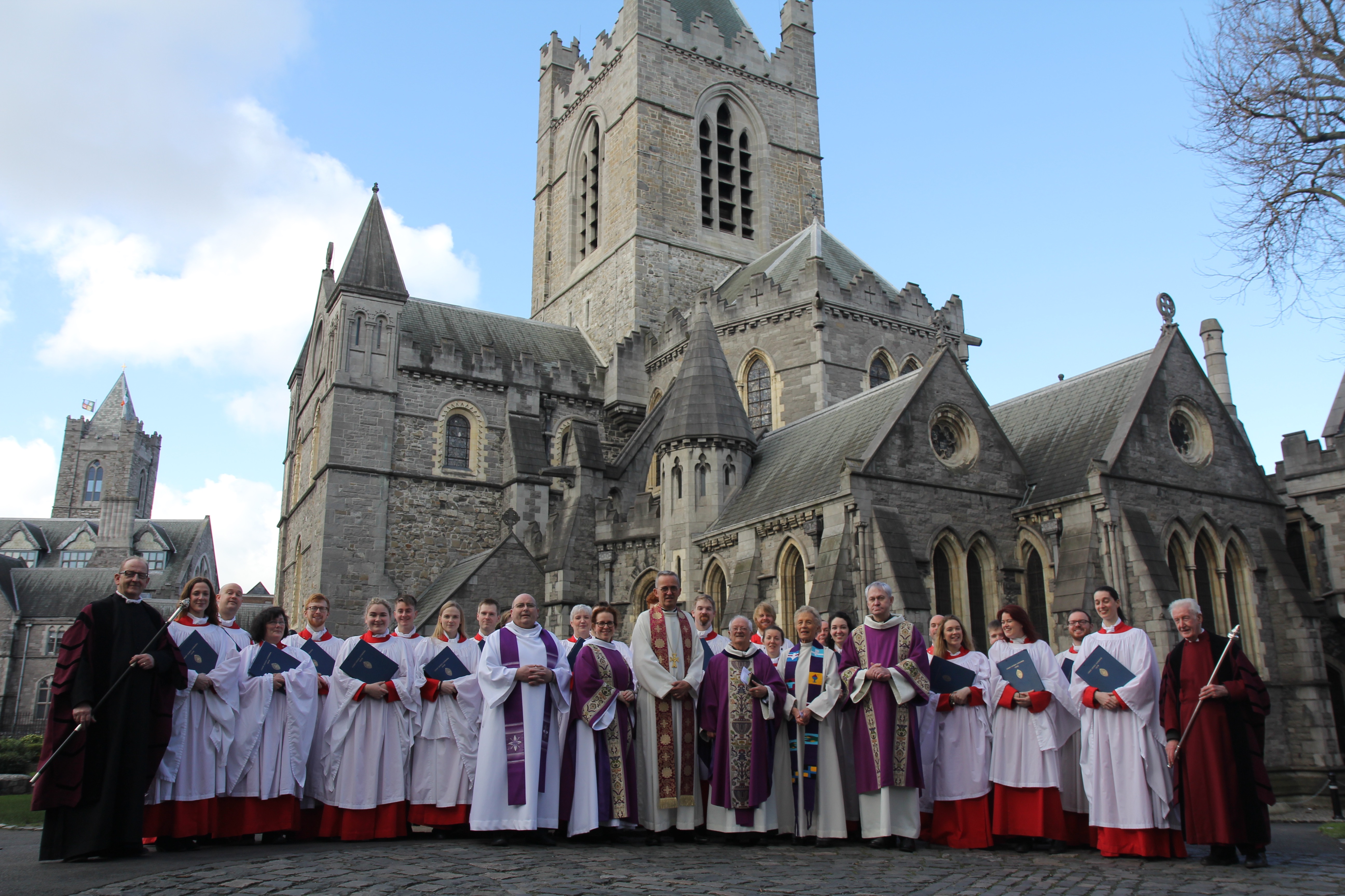 Canon John Bartlett (centre) pictured with the Dean, clergy, Christ Church Cathedral Choir and vergers on the eve of his 80th birthday.