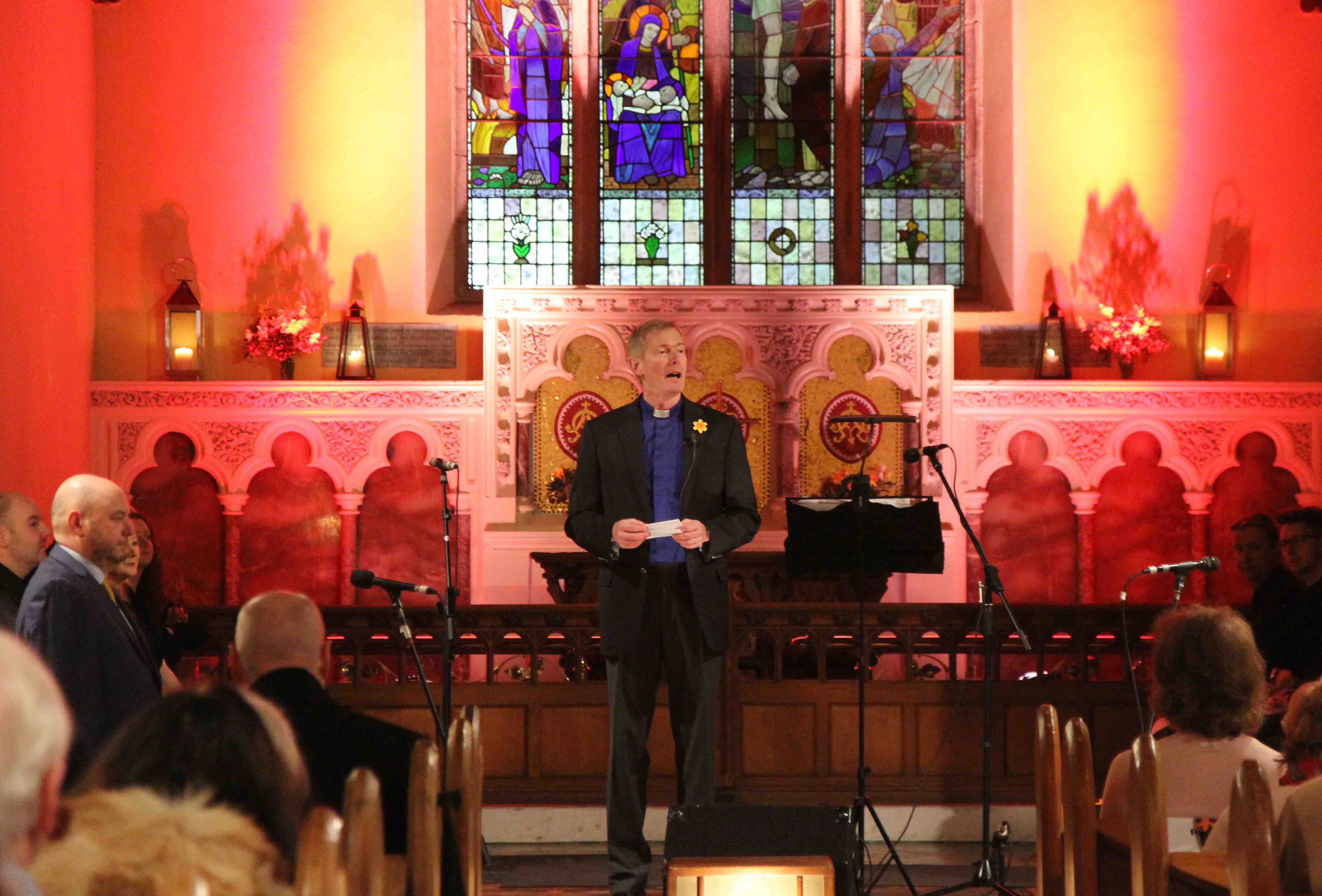 The Revd John Tanner welcomes the audience to Tullow Church.