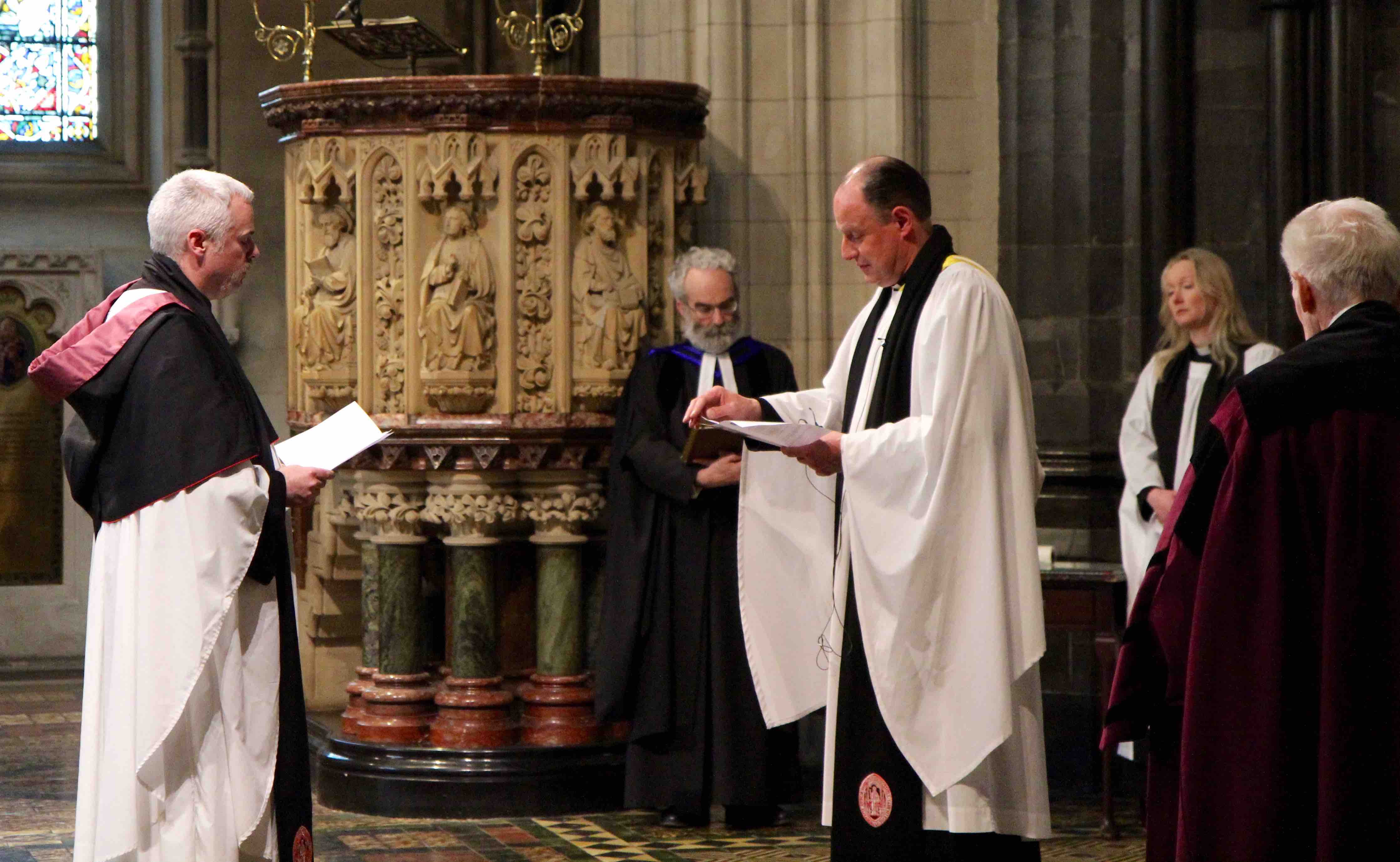 Canon Andrew McCroskery makes the declaration before Precentor Roy Byrne, regristrar the Revd Robert Marshall, Canon Sonia Gyles and verger Freddie McKeown.