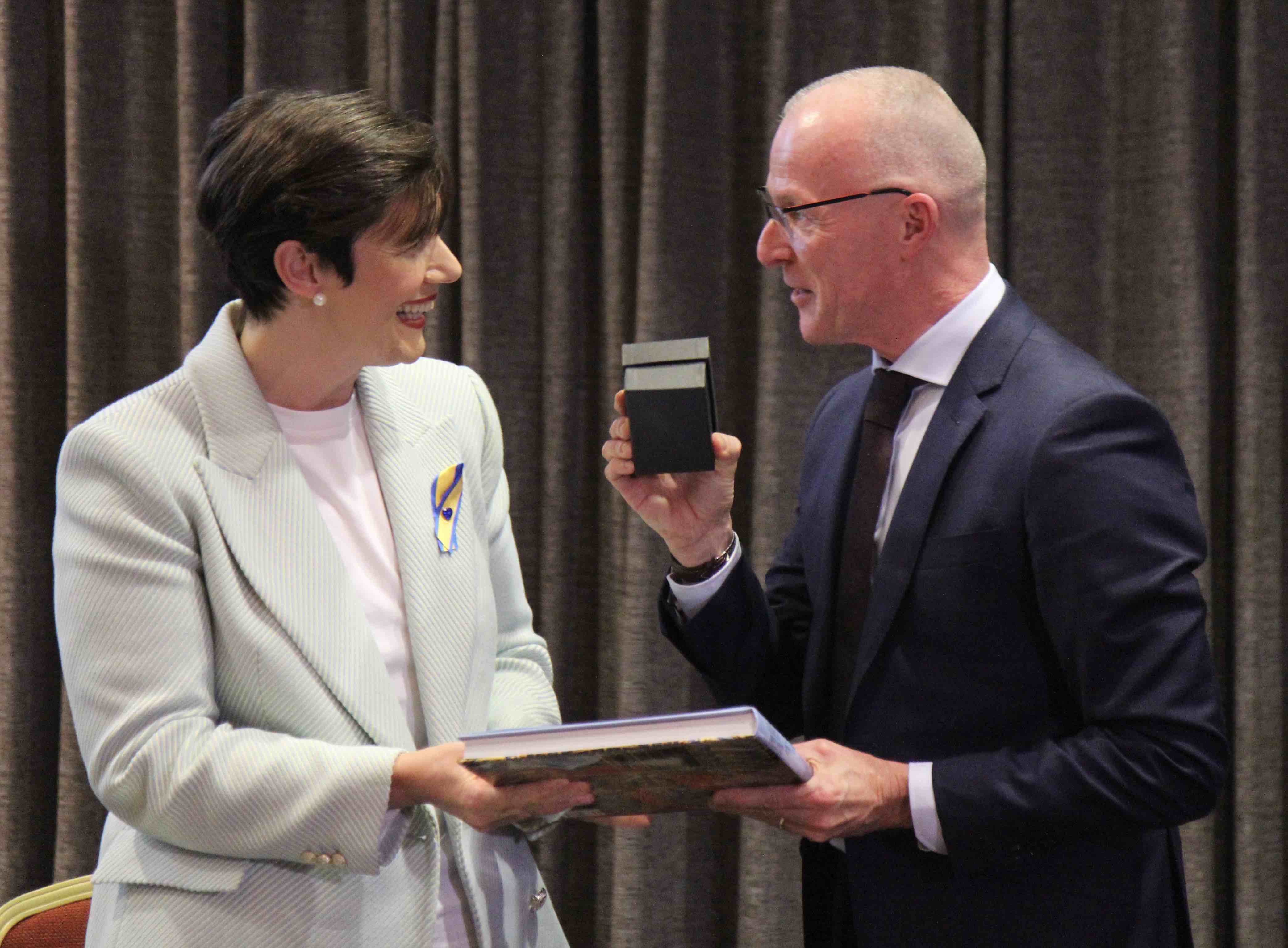 Minister Norma Foley receives a presentation from Lesley Ruttle.