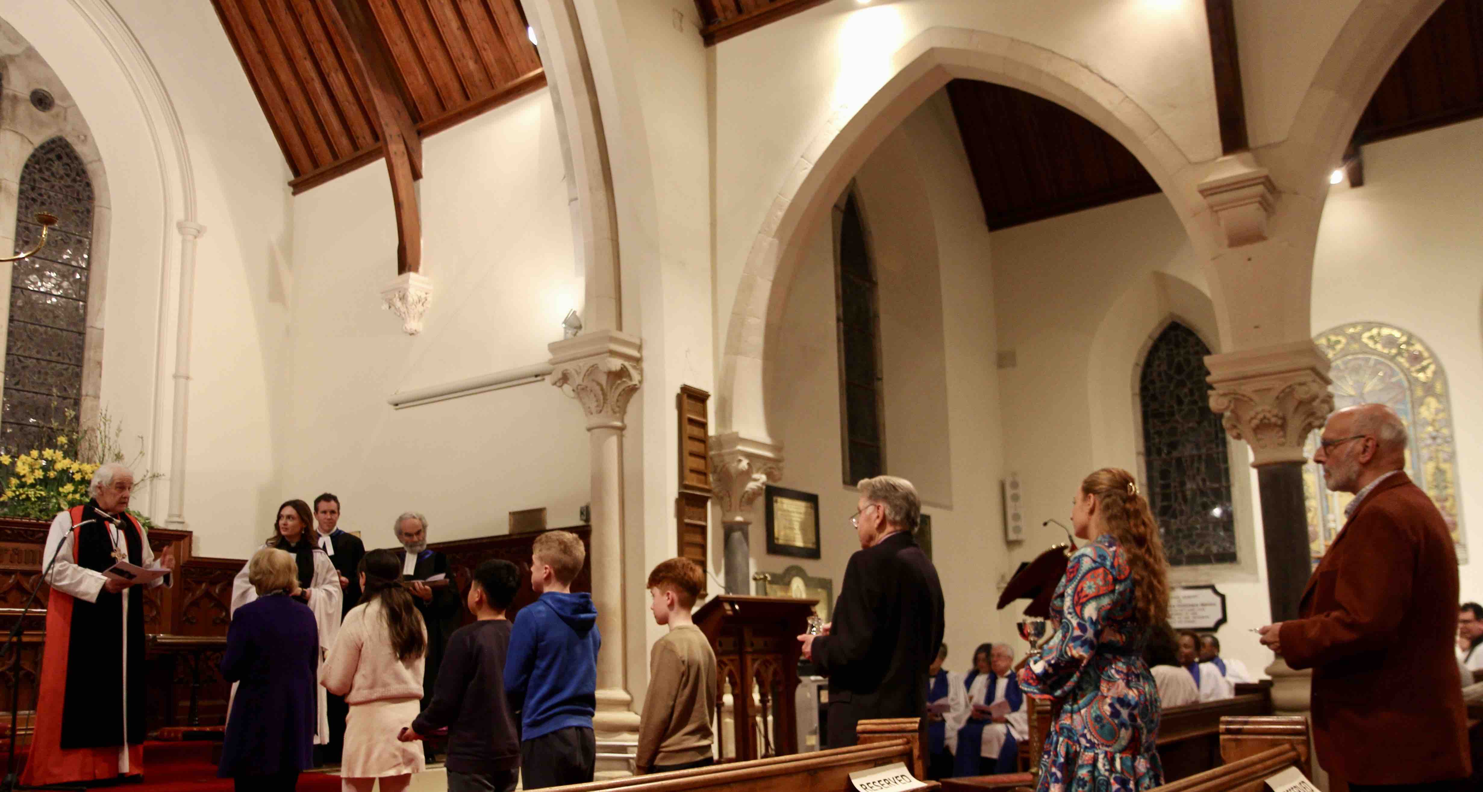 Natasha is presented with the symbols of parish ministry by members of the parish.