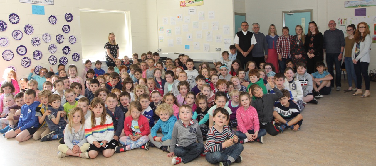 Canon Hatem with teachers and pupils at Nun's Cross School.