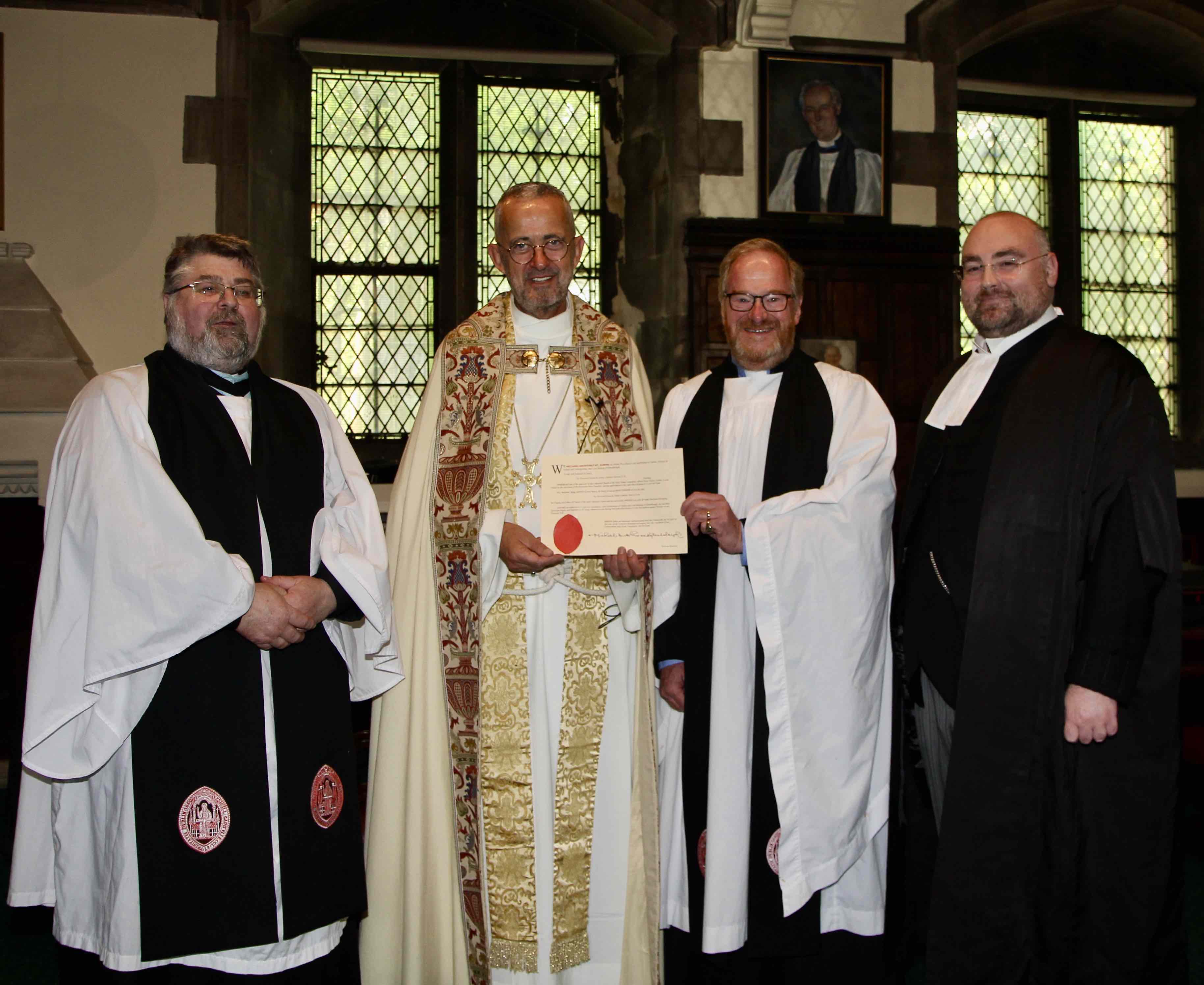 Canon Arthur Barrett receives his declaration from Dean Dermot Dunne, pictured with Archdeacon Neal O'Raw and Ciaran Toland SC.