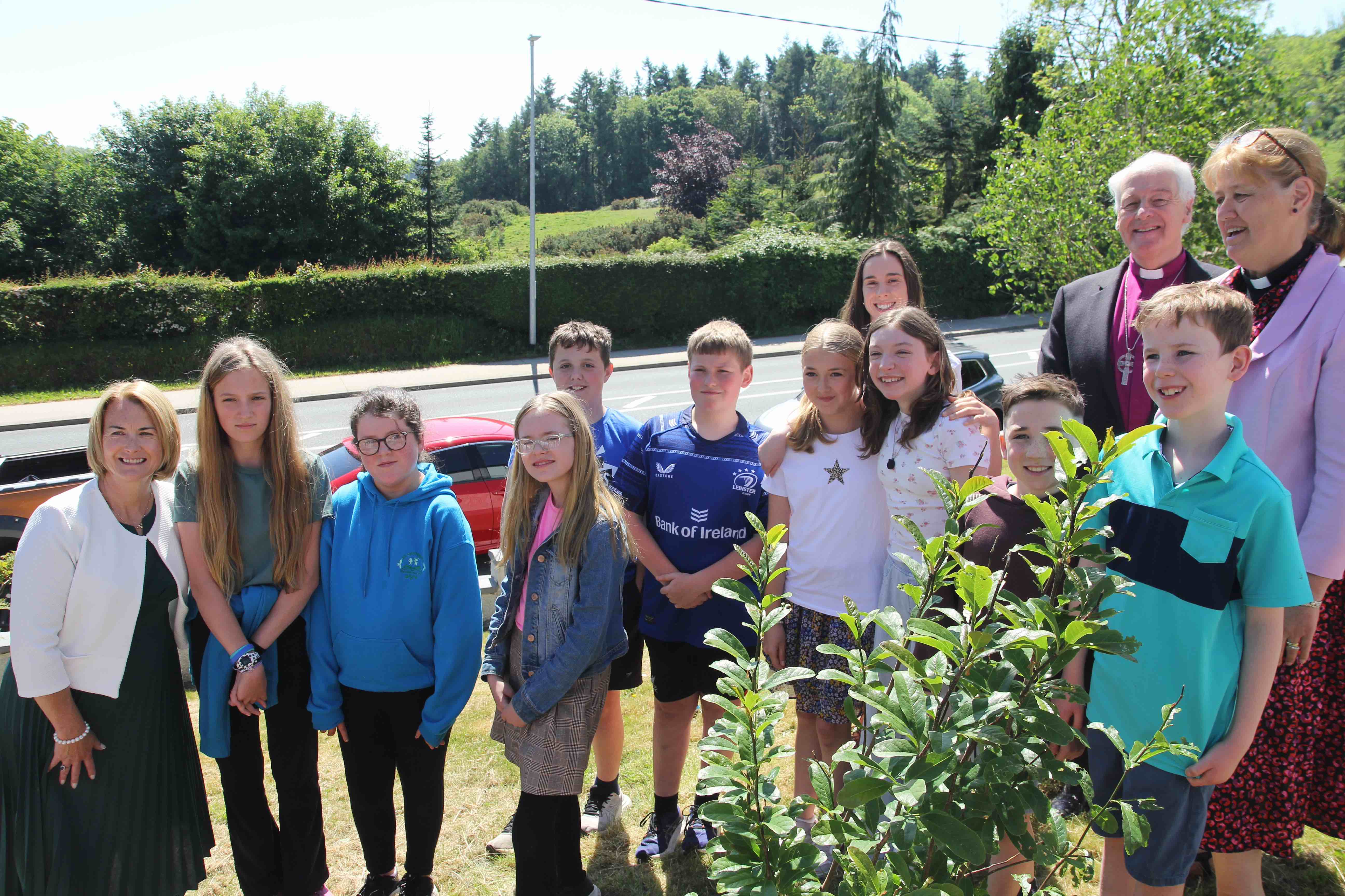 Members of the student council helped the Archbishop plant a tree.