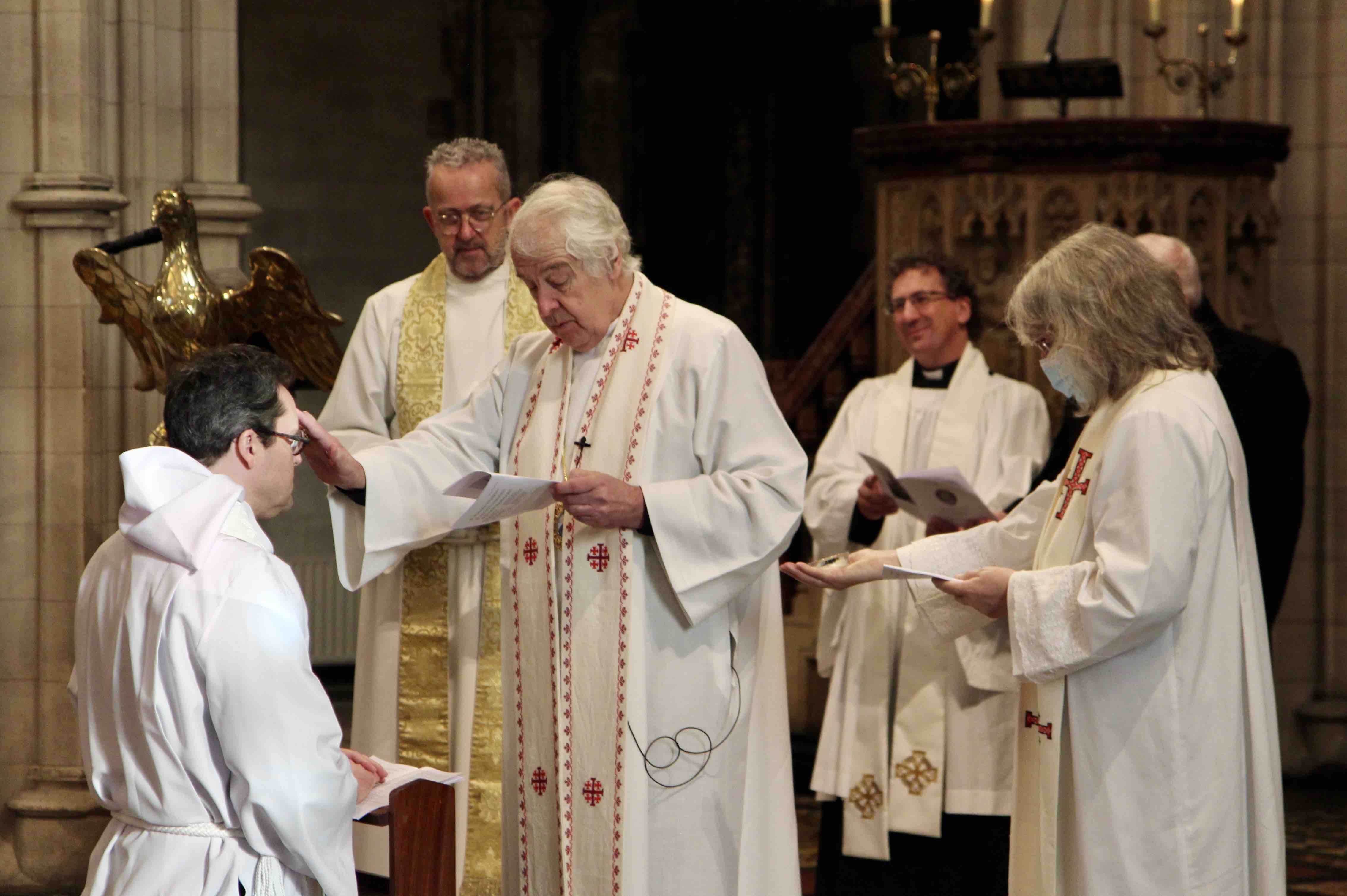 The Archbishop anoints the Revd Edwin Aiken.