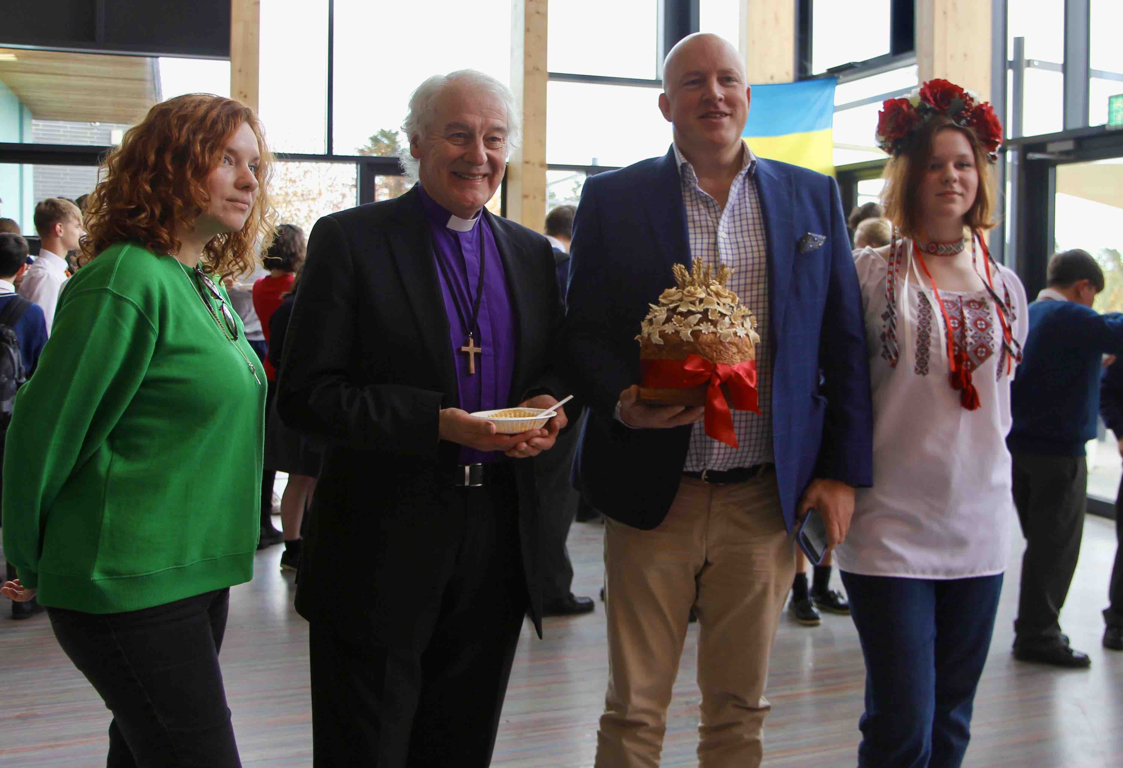 Katrina and Eva Trachuk with Archbishop Michael Jackson and Aubrey McCarthy.