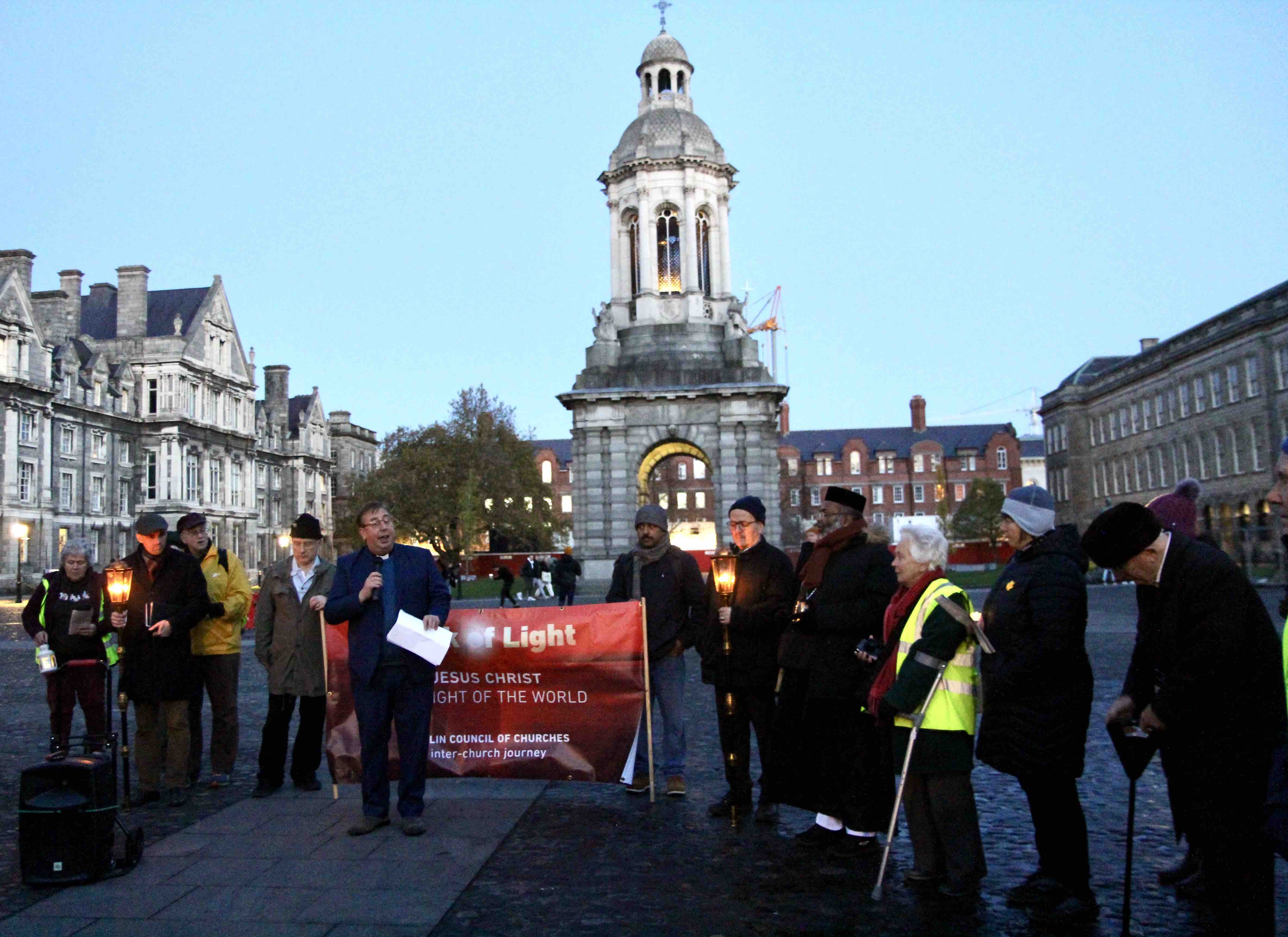 The Revd Steve Brunn addresses participants in the Front Square of Trinity College.