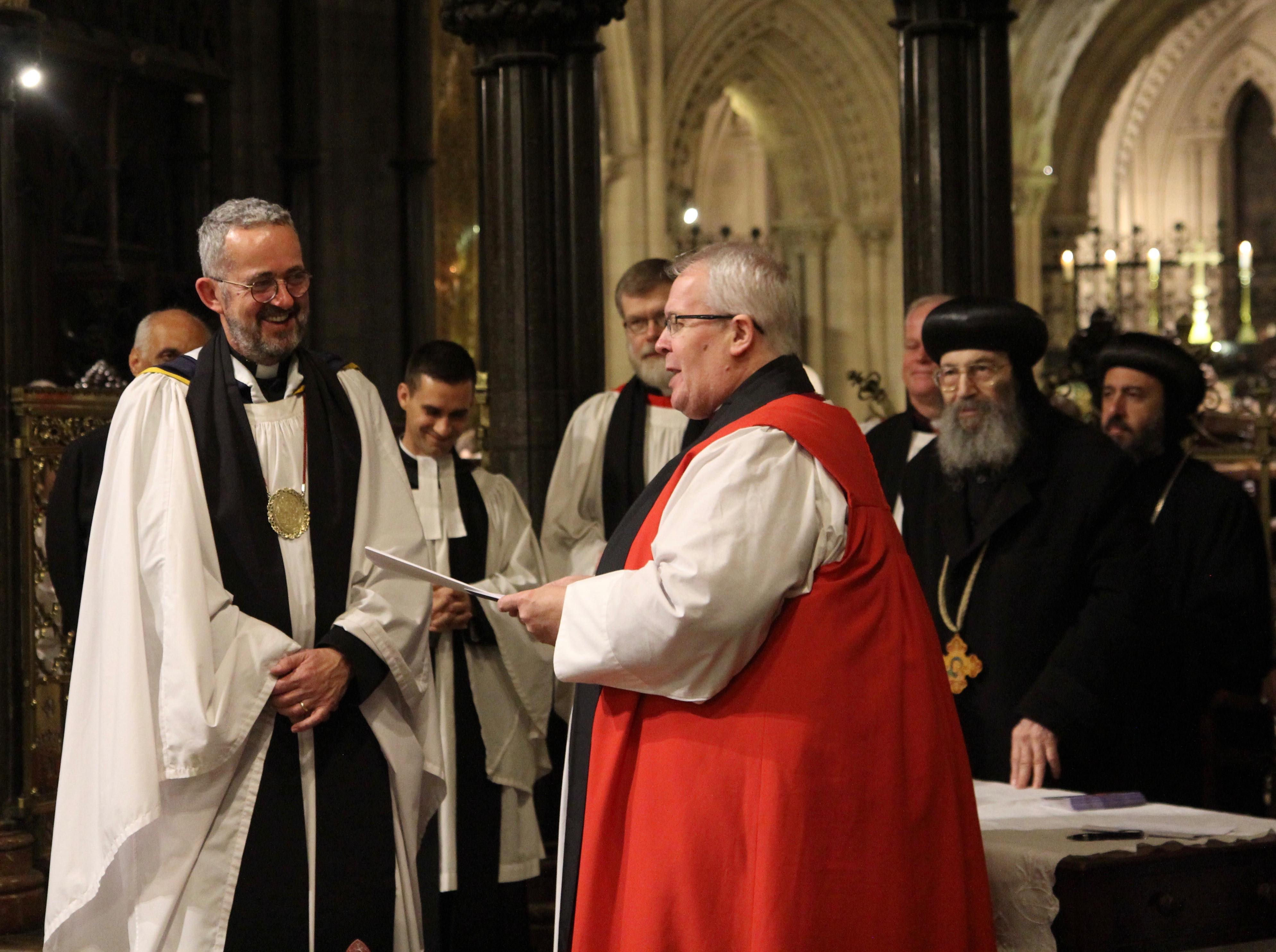 Dean Dermot Dunne is presented with a copy of the historic Dublin Agreement by the AOOIC Co-Chairs