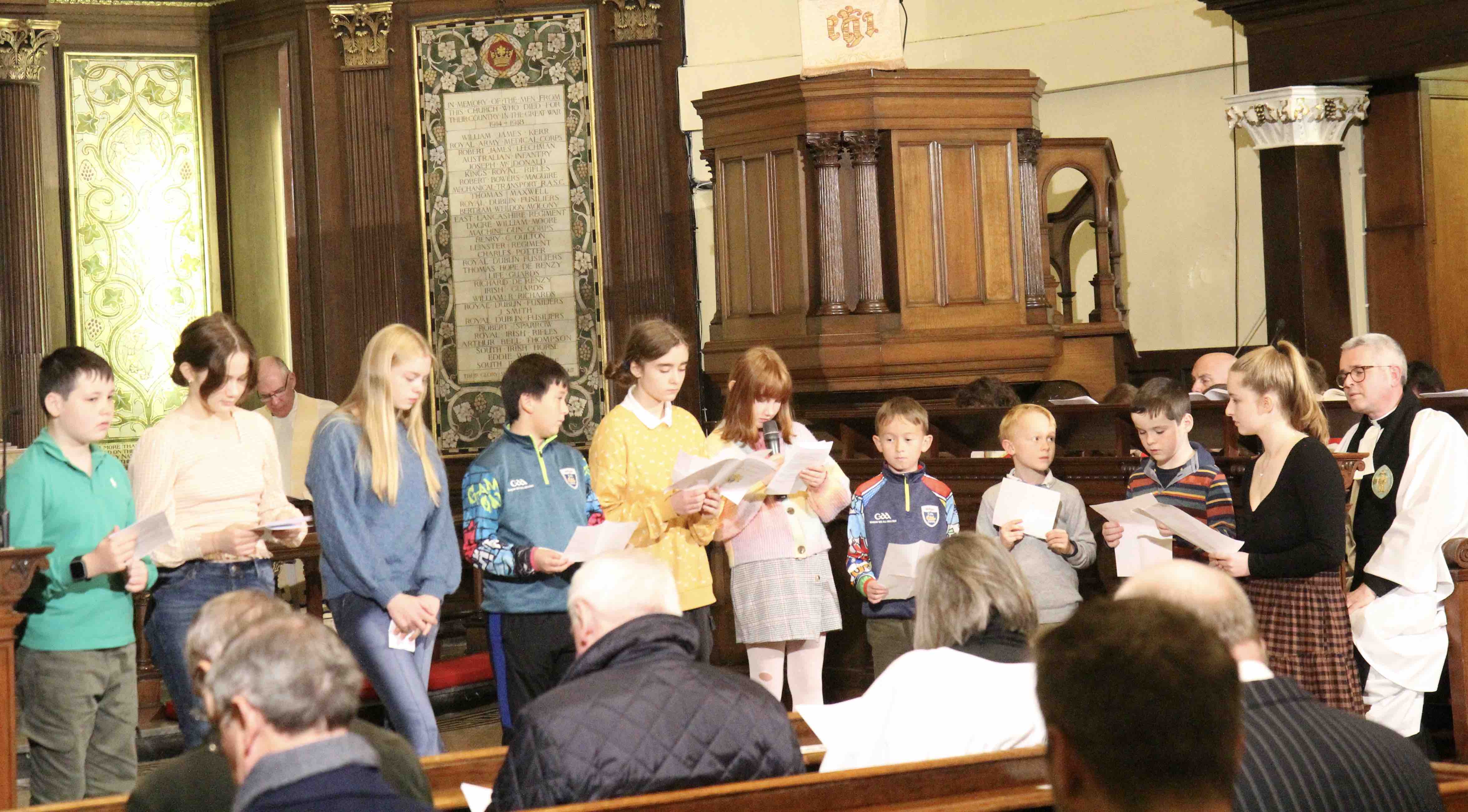 Children of the parish leading the prayers.