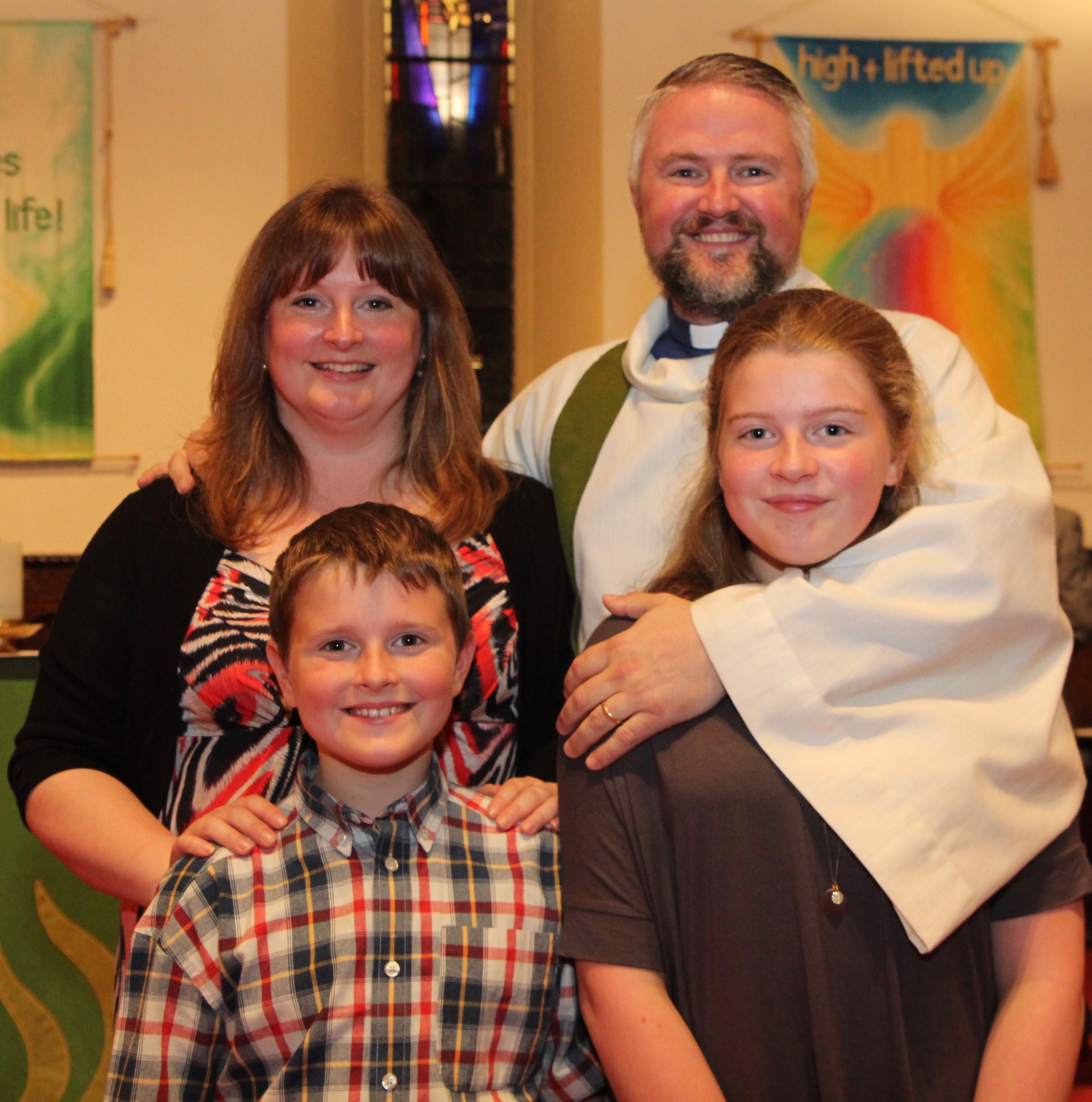 The Revd Alan Breen with Ruth and their children.