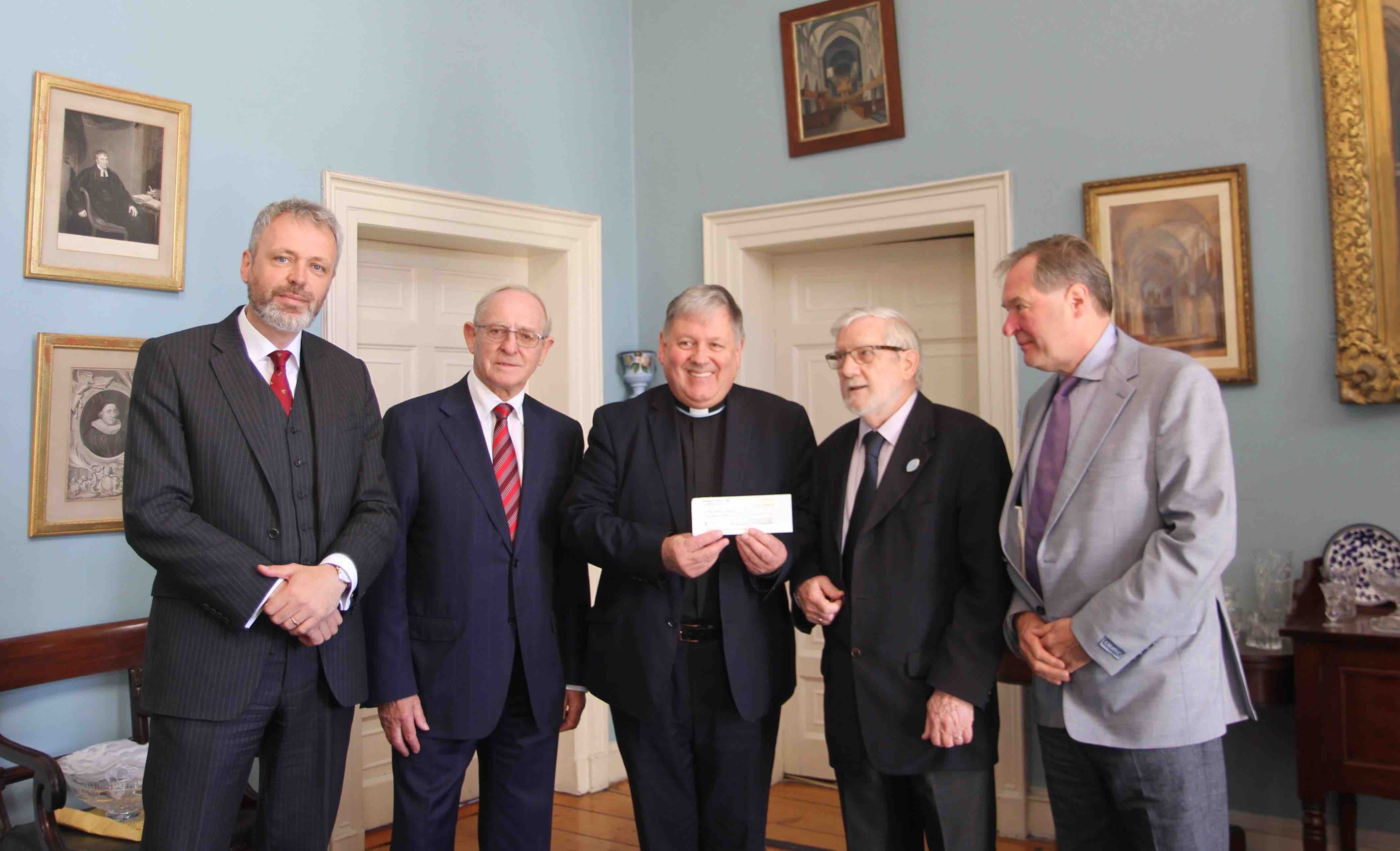 The Friends of St Patrick's Cathedral presented the Dean with a cheque for the roof restoration fund. Pictured are cathedral administrator Gavan Woods, George Good, Dean William Morton, Albert Fenton and Derek Seymour.