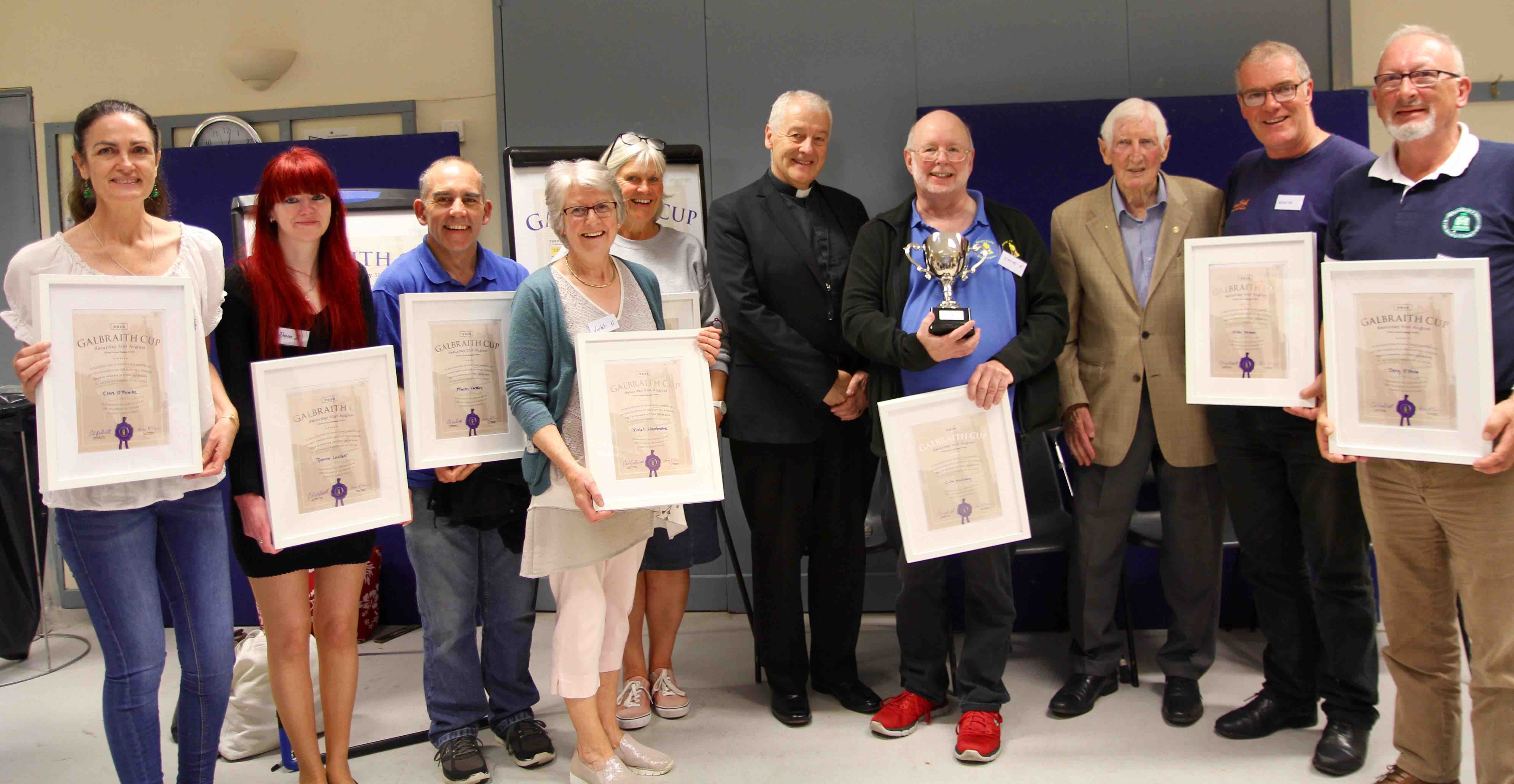 The winning team of the inaugural Galbraith Cup - Team 8 - with Cyril Galbraith and Archbishop Michael Jackson.