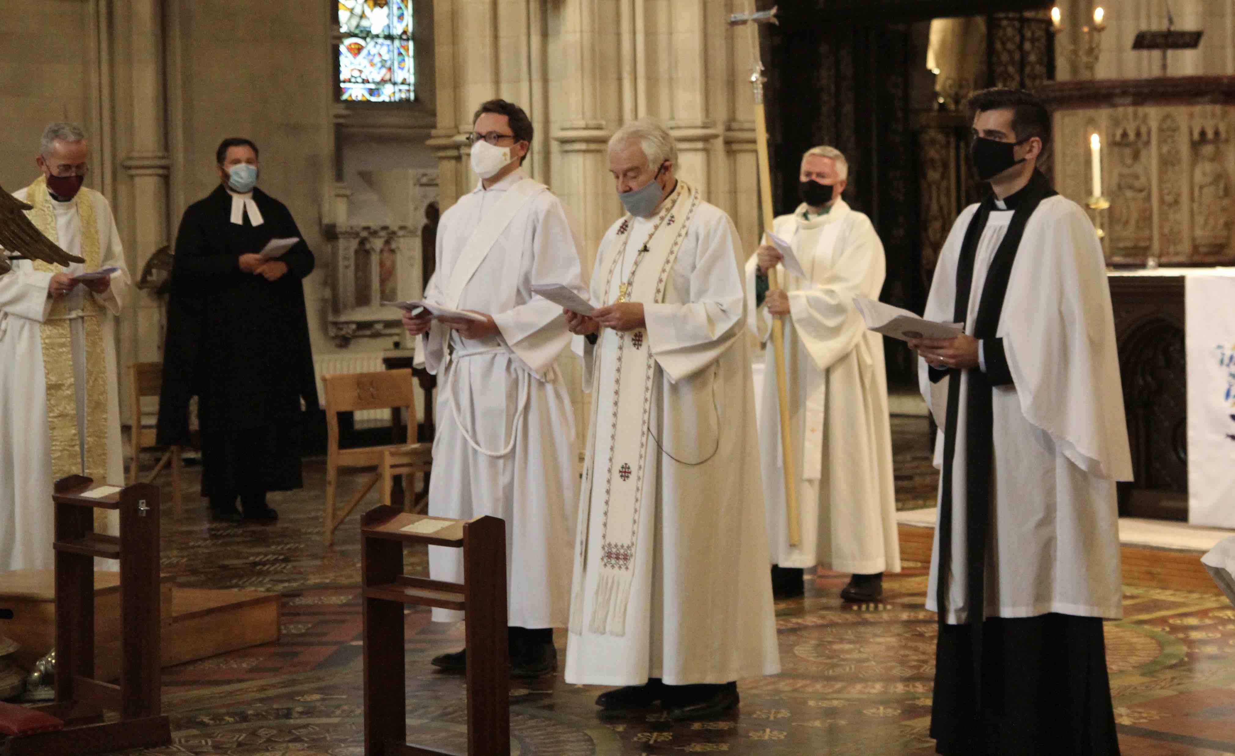 The Revd Edwin Aiken and the Revd Alexander Chisnall are greeted by the congregation following their ordination to the diaconate.