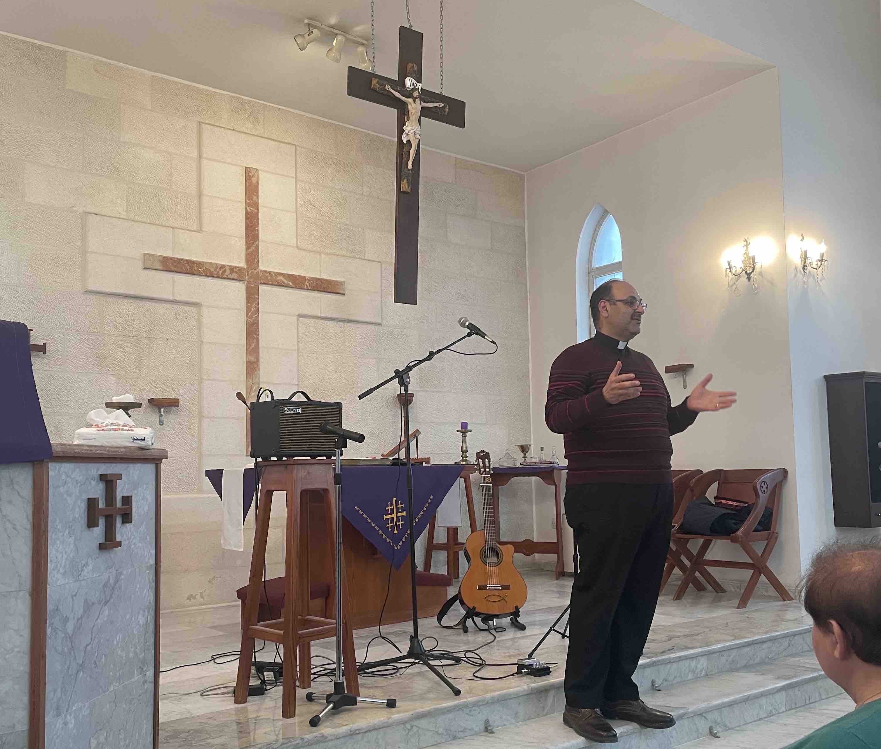 The Revd George Copty welcoming the congregation to St Luke's Church, Marka.