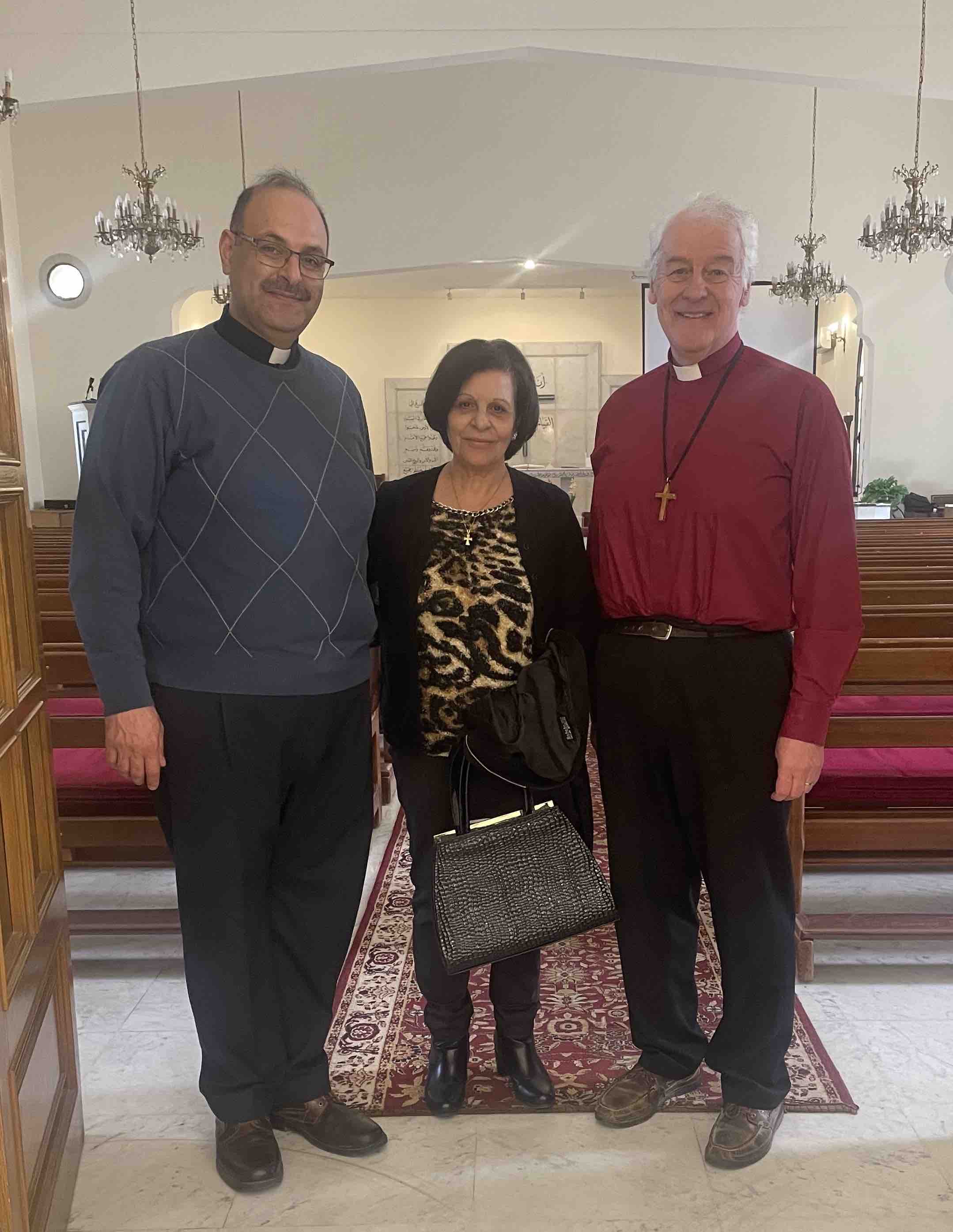 Archbishop Michael Jackson with the Revd George Copty and his mother at St Paul's.